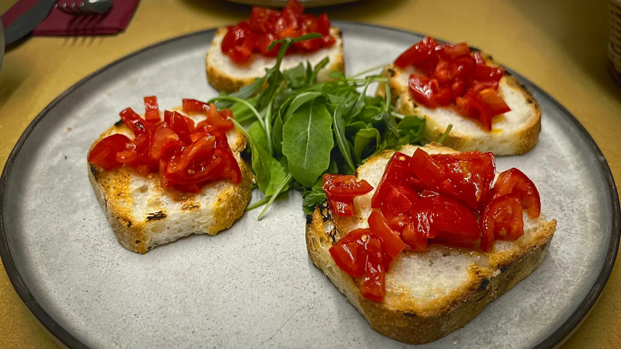 Bruscetta. A low angle shot with tomatoes that pop.