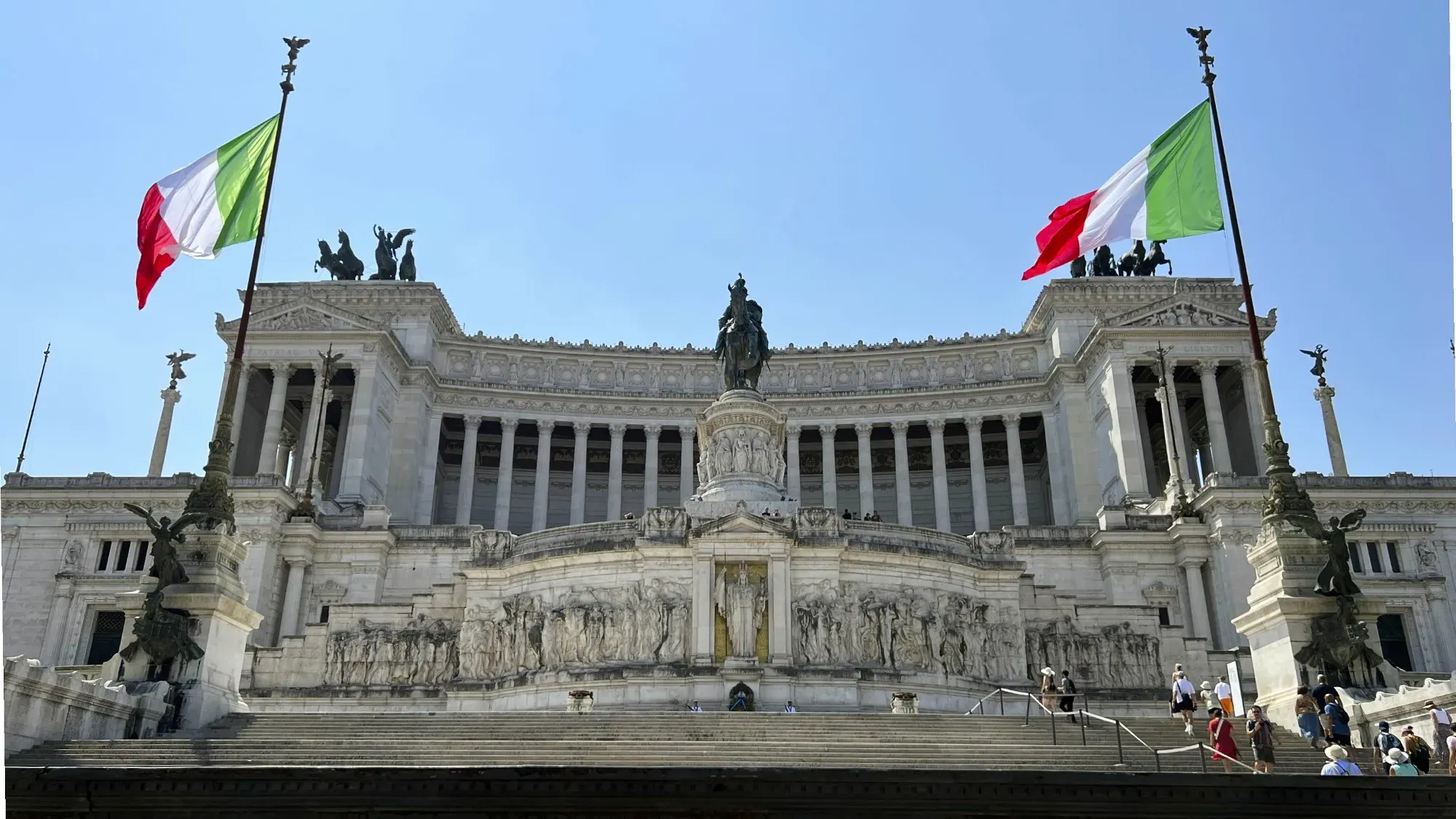 Altar of the Fatherland. Front shot with waving Italian flags.