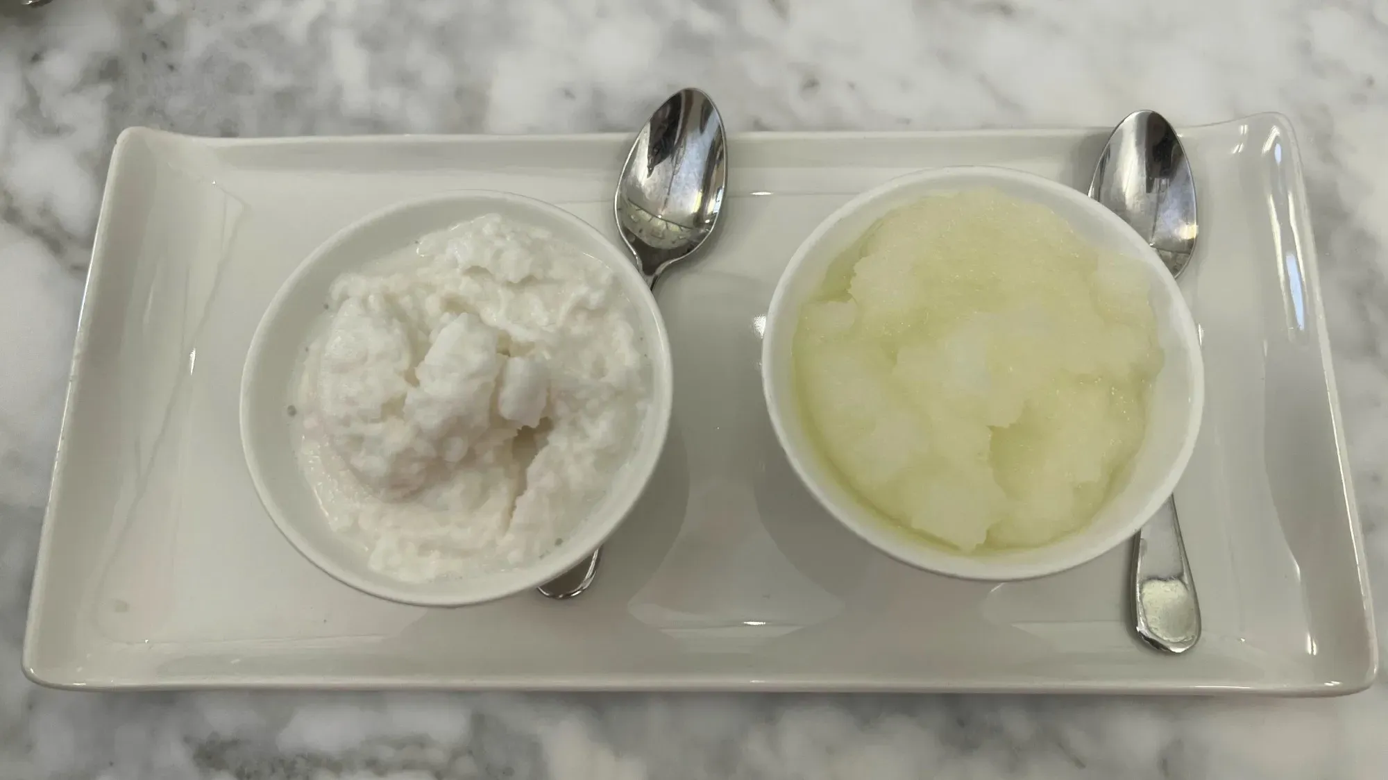 Granita. Overhead shot of almond (left) and lemon (right). 