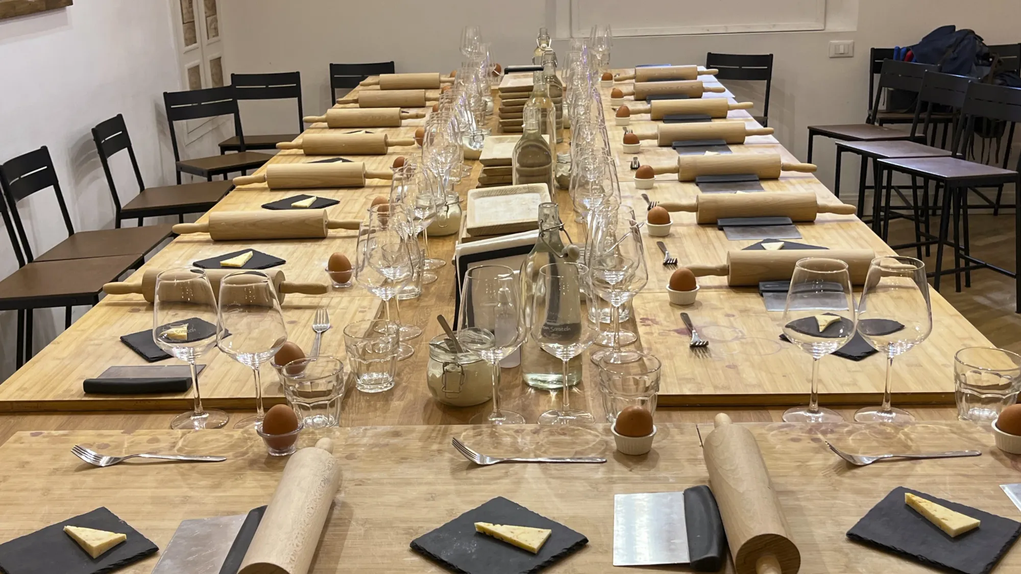 Table set for a pasta making class.