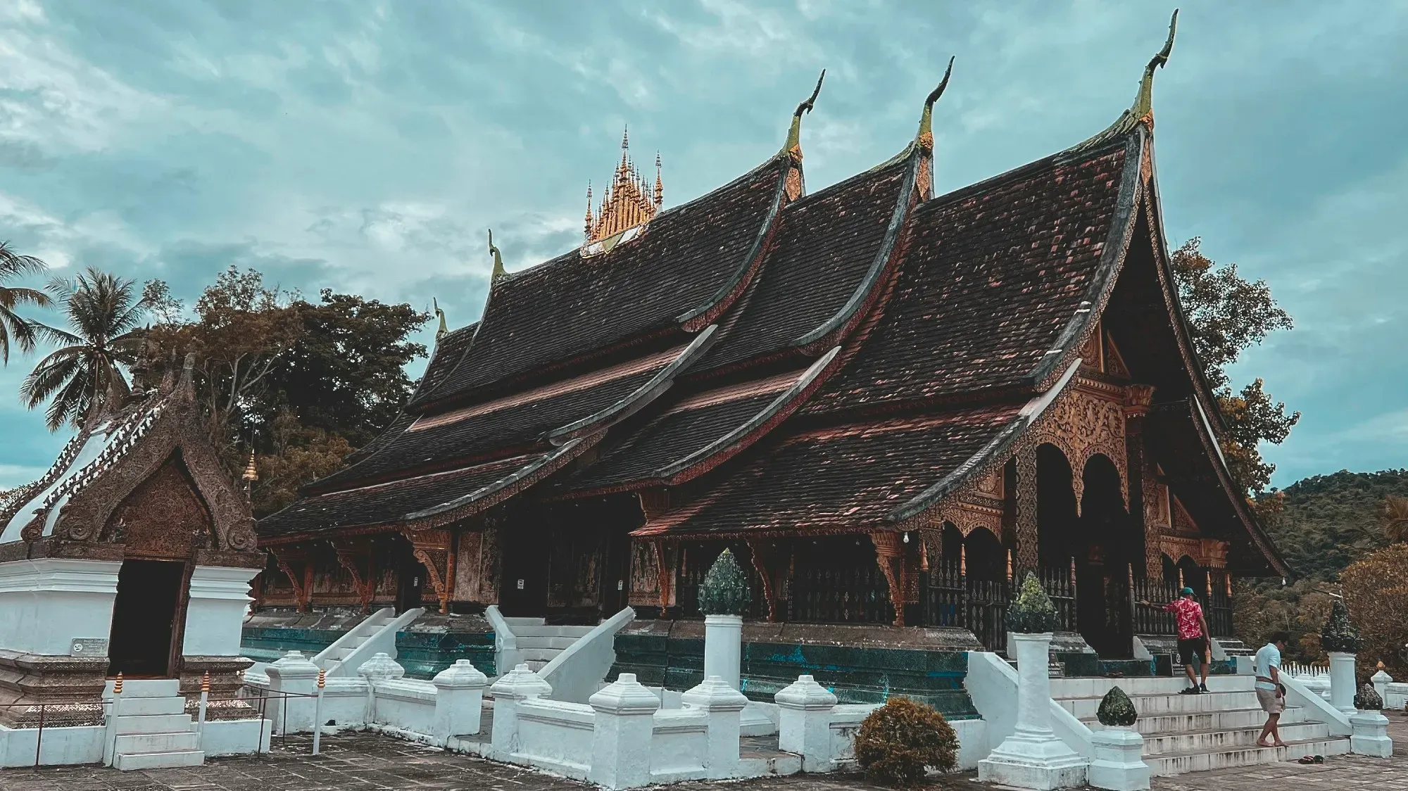 Wat Xieng Thong, shot from exterior side and front of temple.