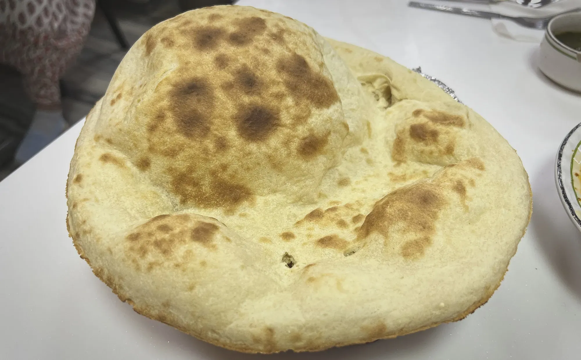 Close up, angled shot of a large Roti.