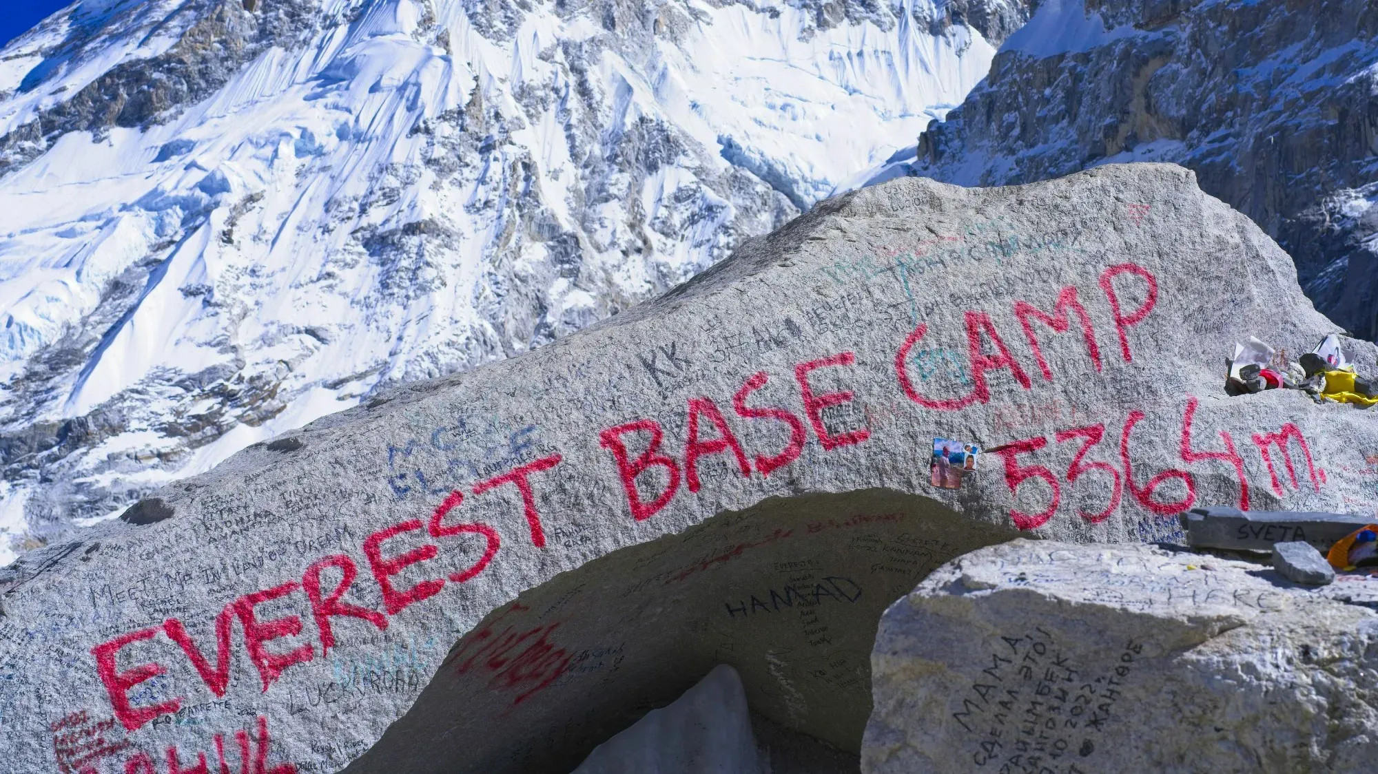 Rock with red spray paint saying "Everest Base Camp 5364m."