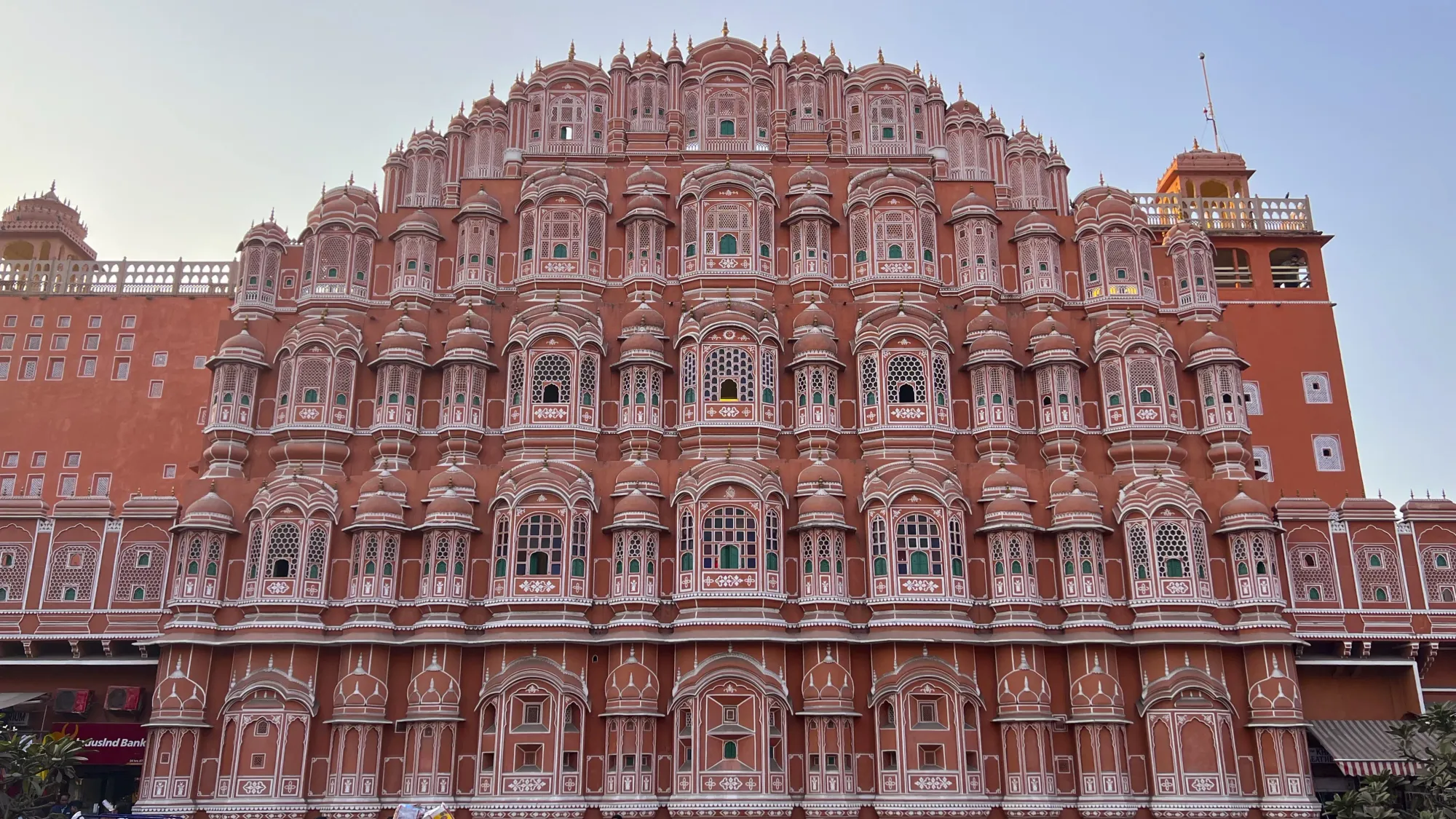 Pink face of the Hawa Mahal covered in screens