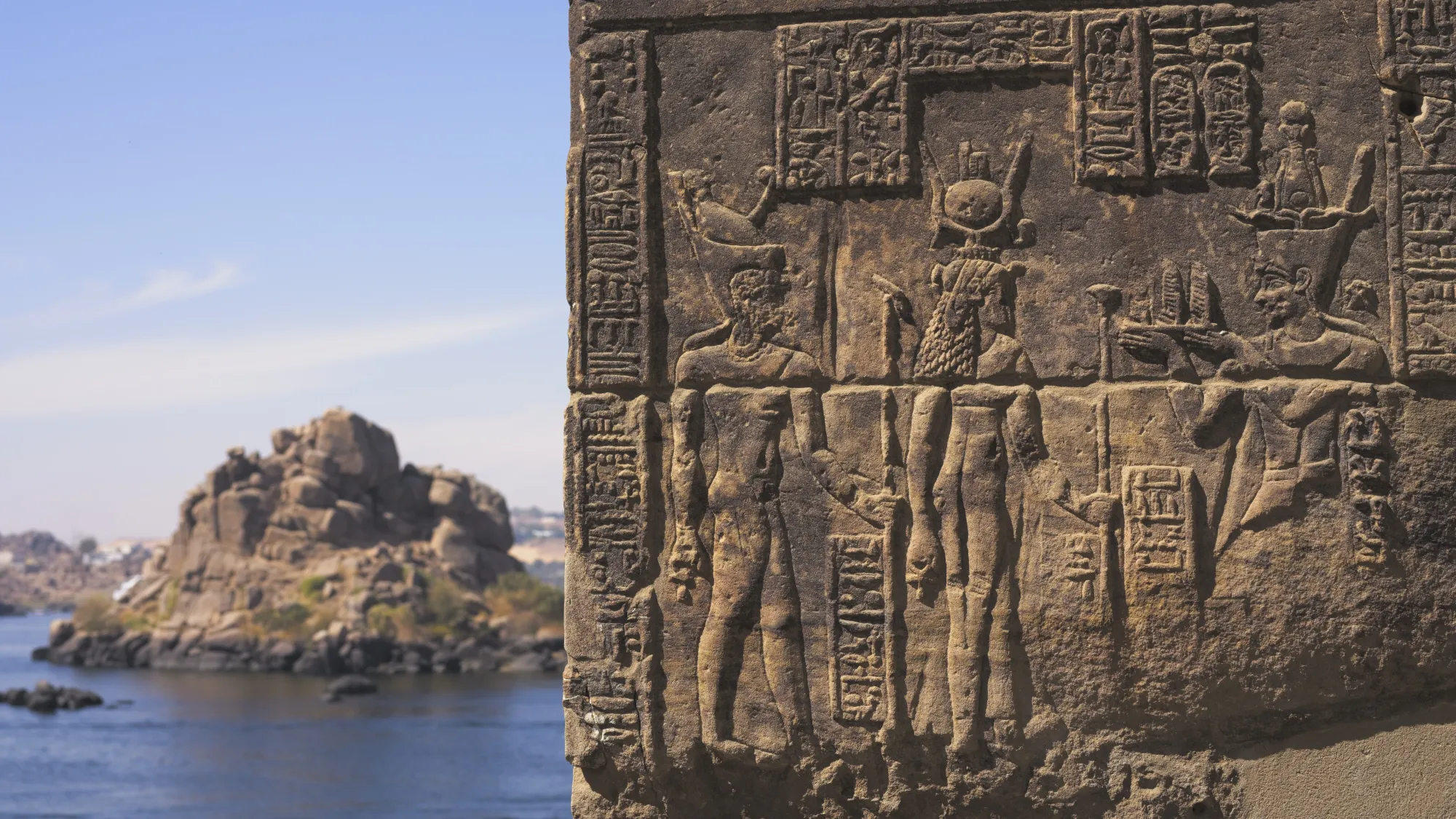 Close-up of reliefs and hieroglyphics overlooking the river