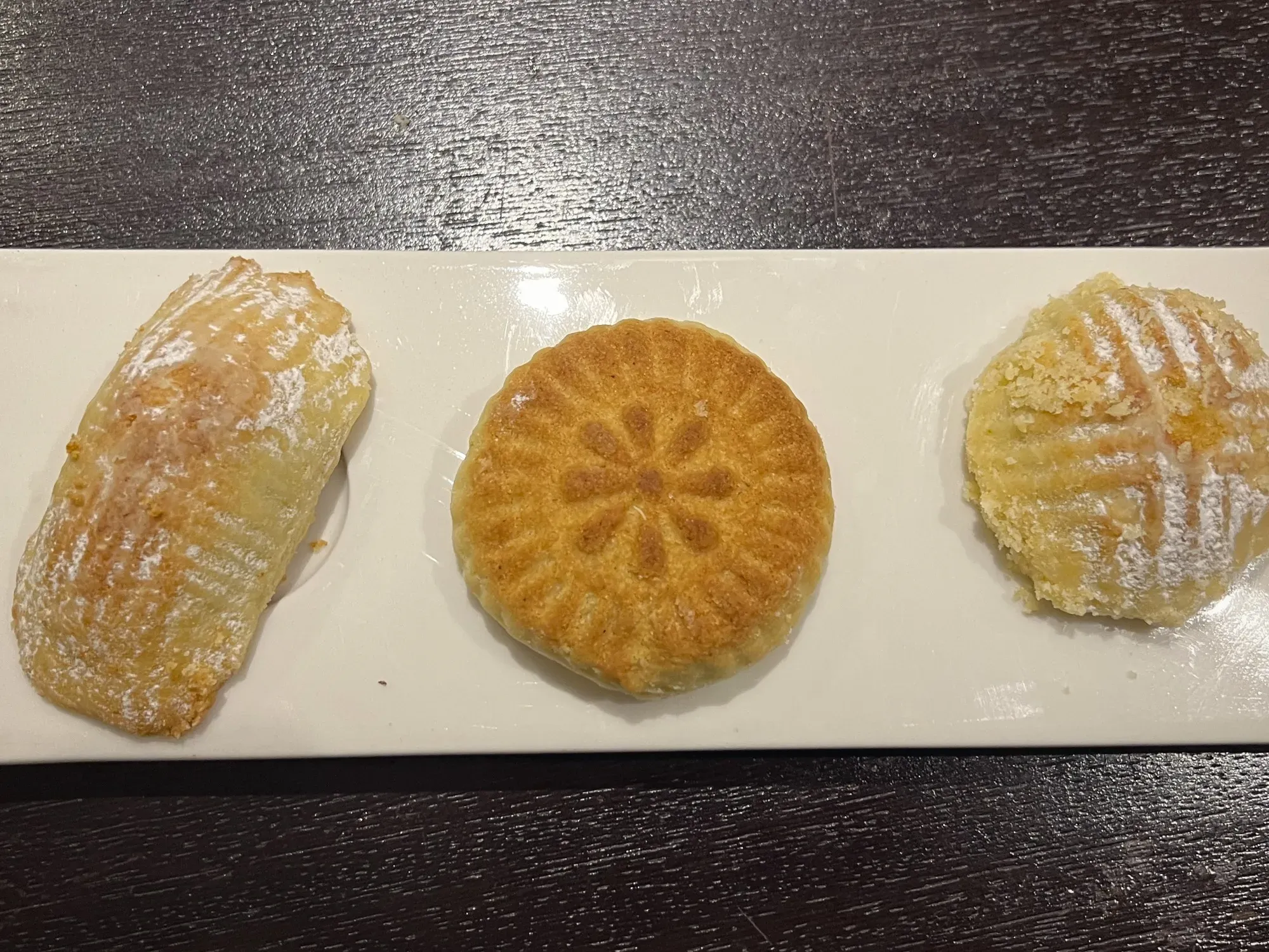 Three different types of Ma'amoul on a tray, overhead shot.