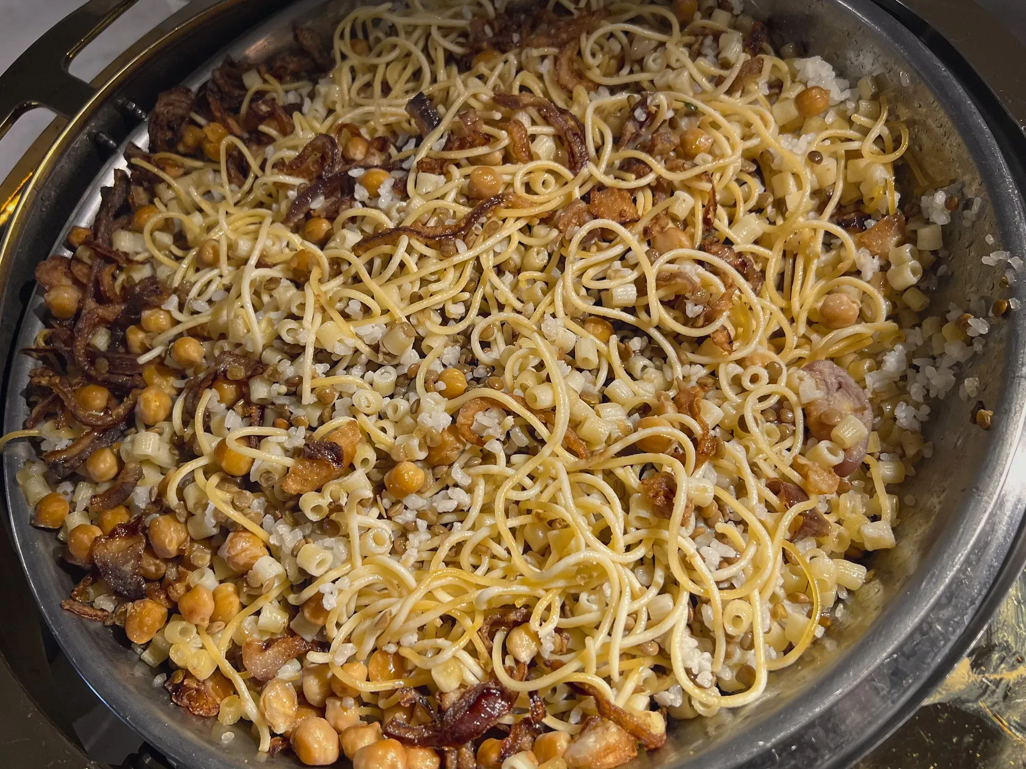 Close up overhead shot of serving tray of Koshari.