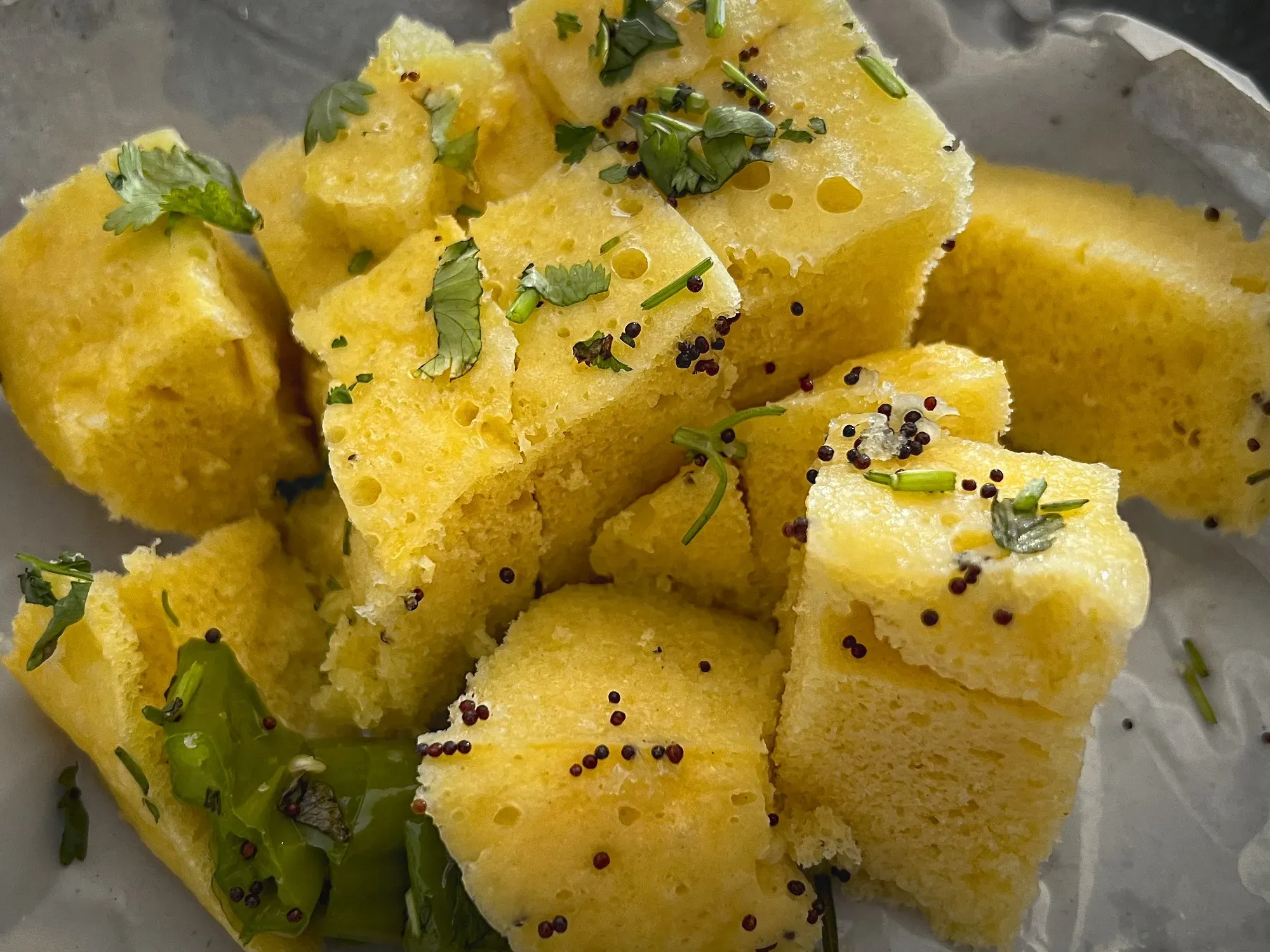 Close up shot of a bunch of Dhokla.