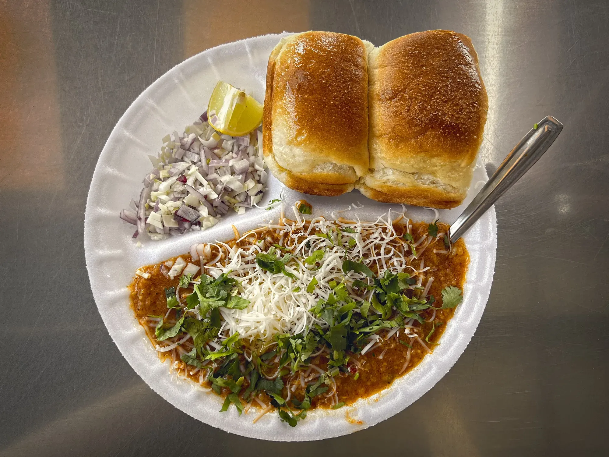 Pav Bhaji in a tray, overhead shot.