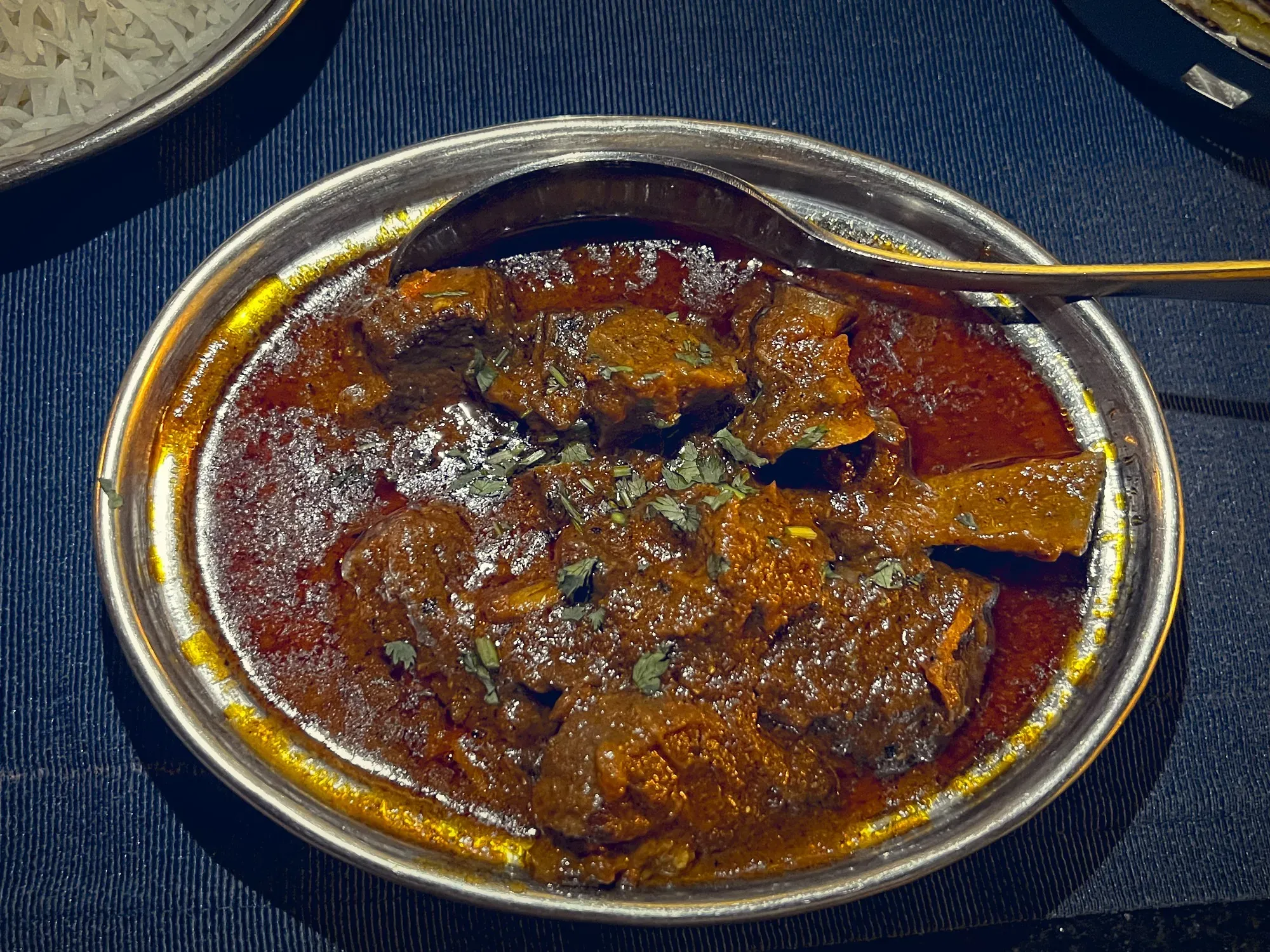 Rogan Josh in a small serving bowl, overhead shot.