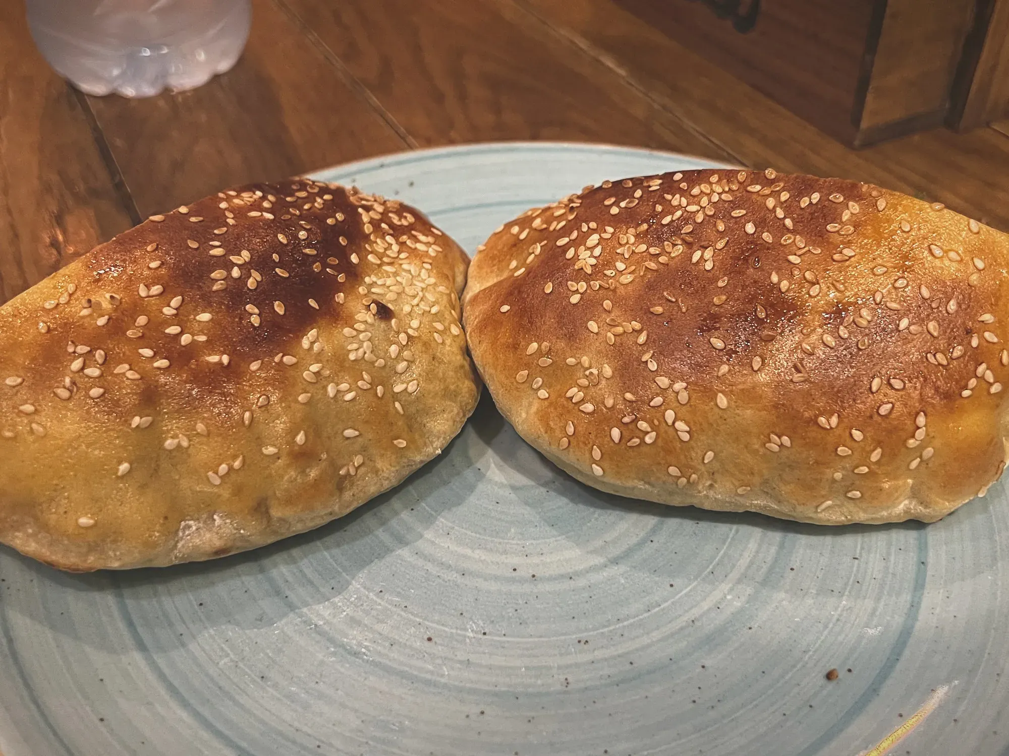 A piece of Khamir, cut in half, on a plate.