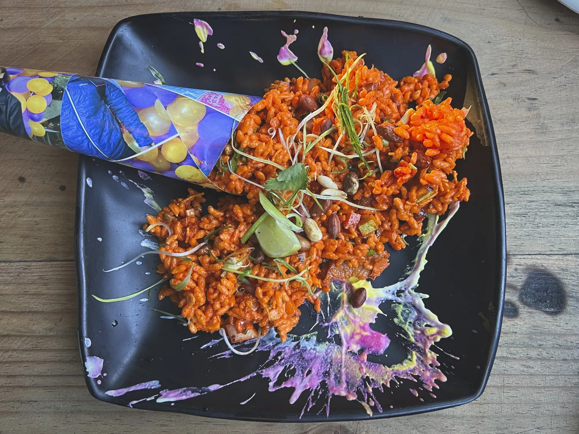 Overhead shot of artistic Chatpate on a plate with paint splattered sauce.