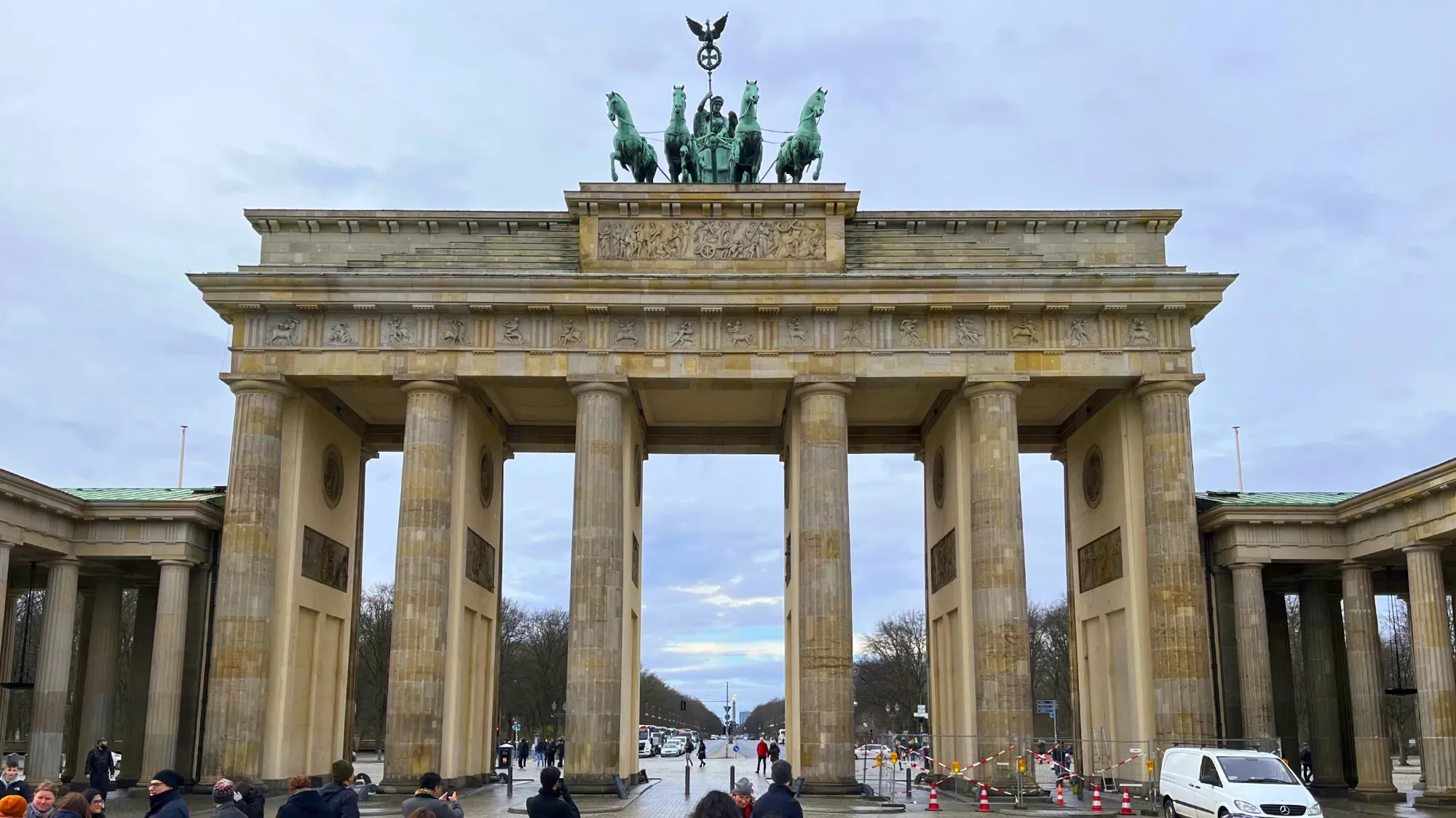 Stone gate constructed of six tall columns with a copper chariot on top