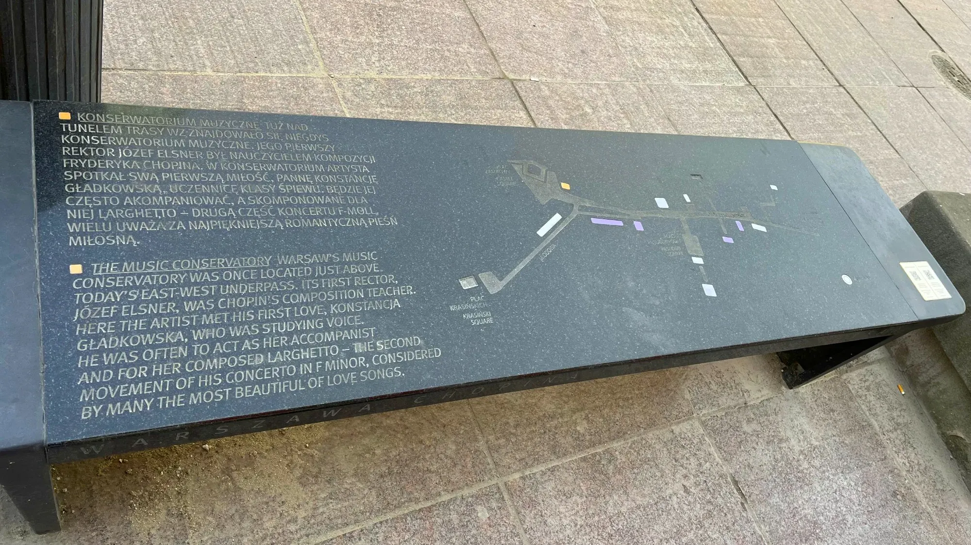Black bench with a map of other bench locations on it