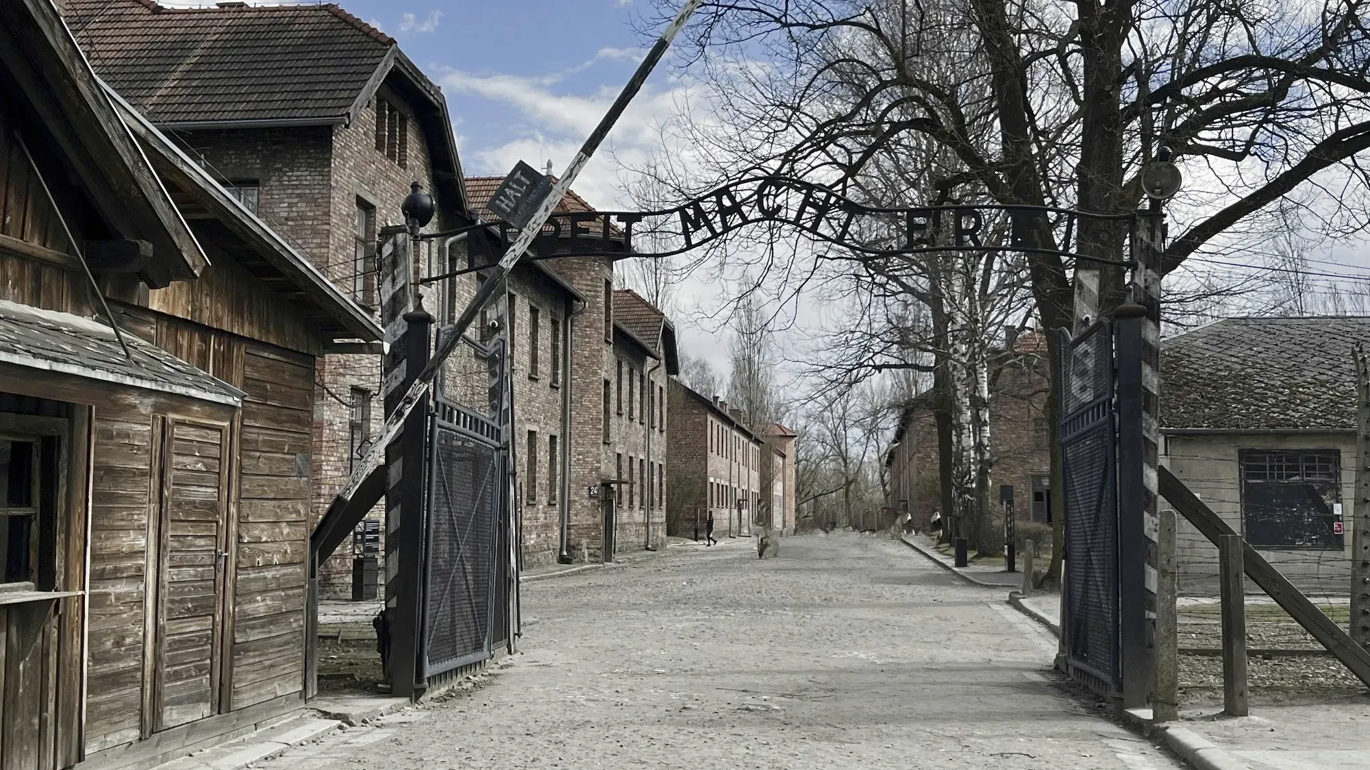 Brick buildings with a black gate with German words