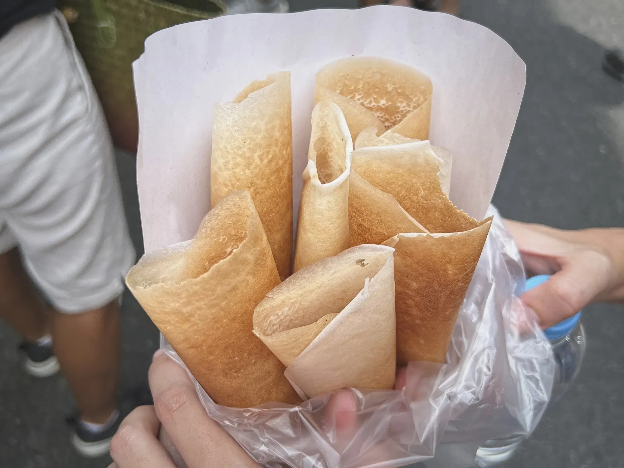 A plastic bag full of coconut crepes.