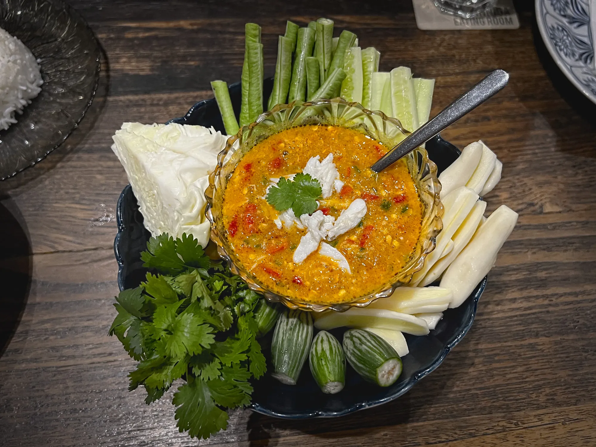 Nam Prik Khai Pu surrounded by all the vegetables for dipping, overhead shot.