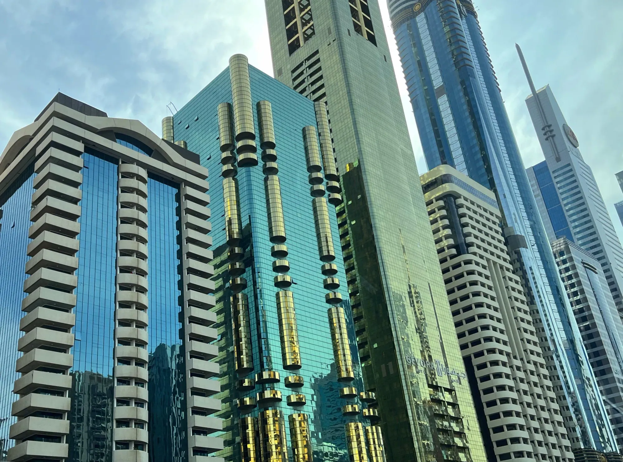 Shiny glass skyscrapers in blue and green tones