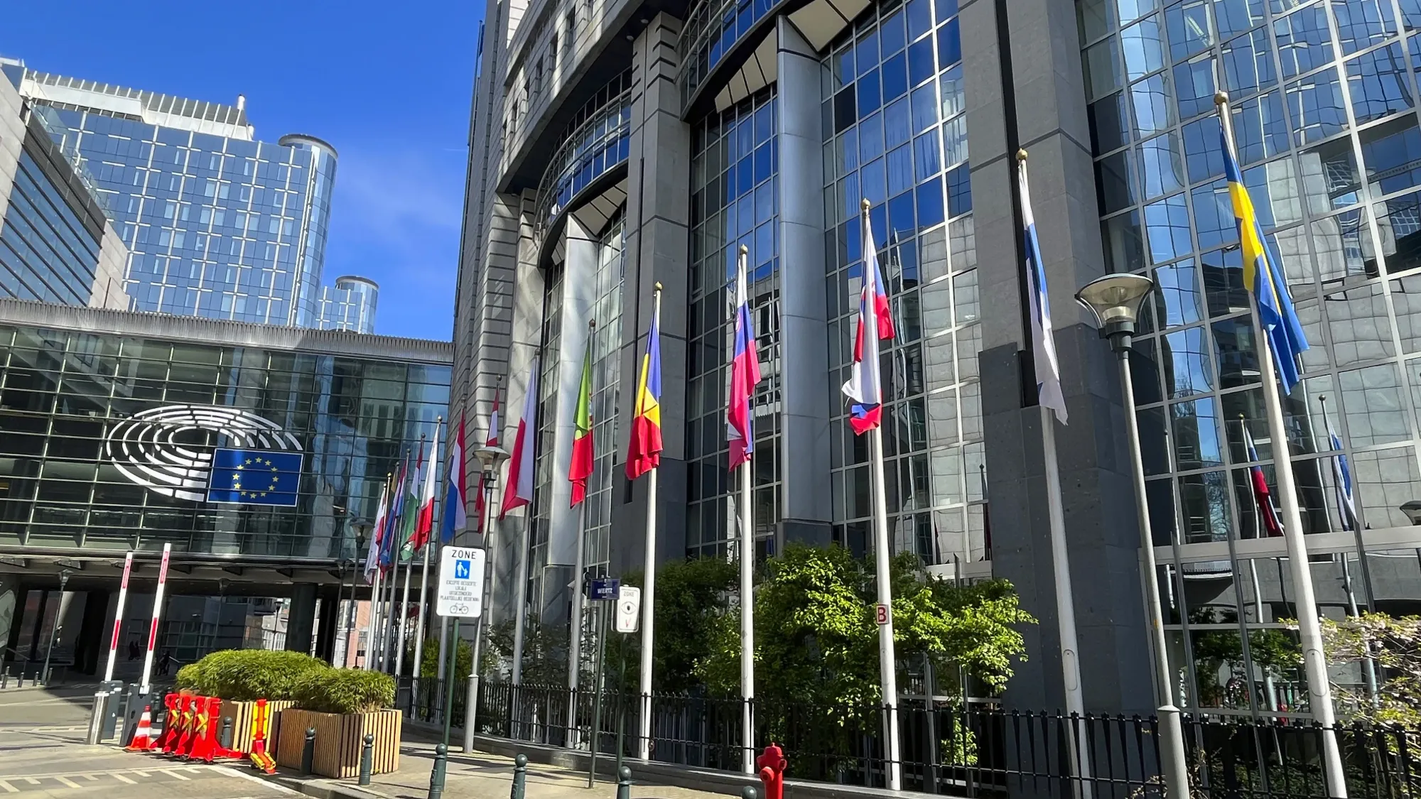 Glass building with EU country flags in front