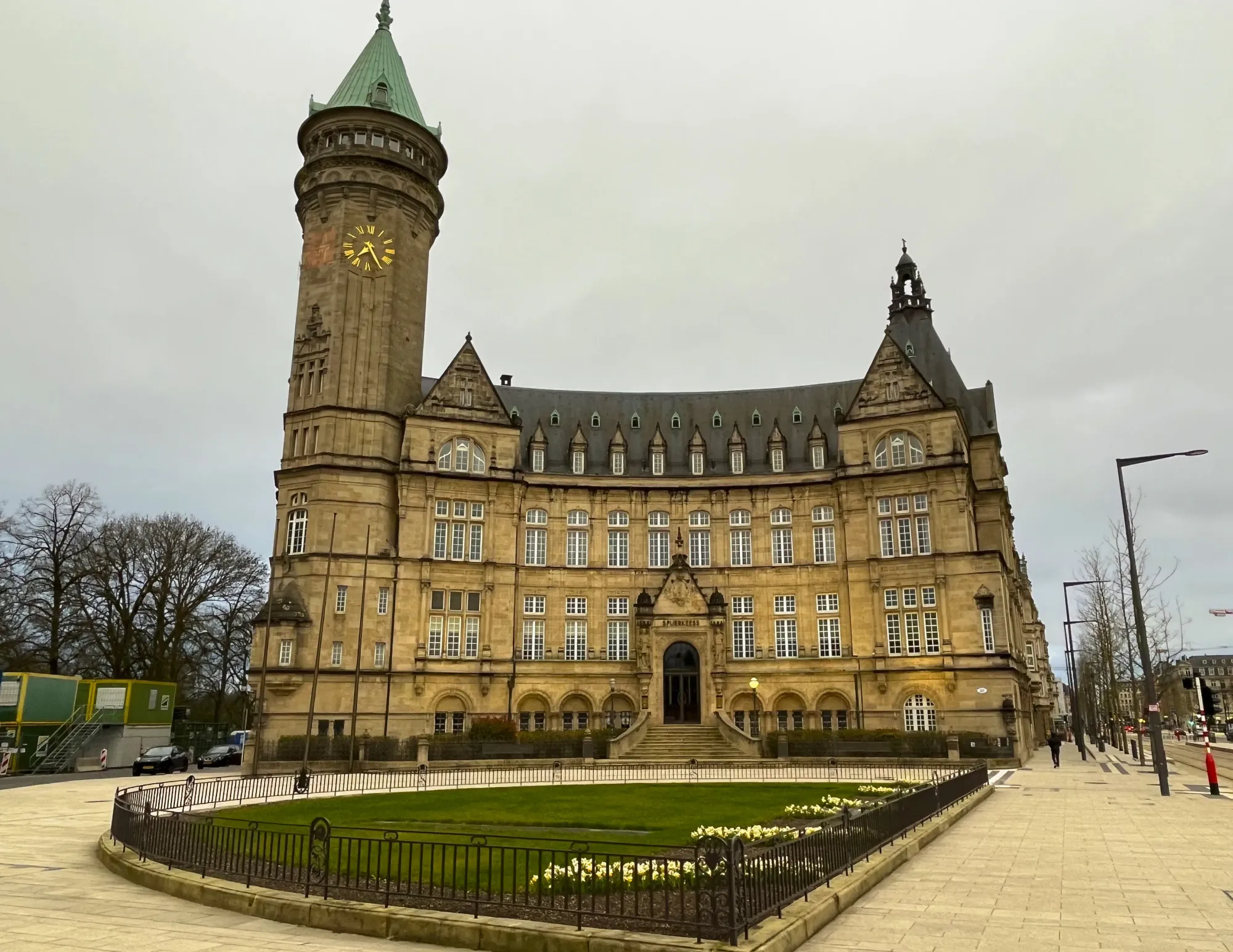 Yellow stone building on the modern Luxembourg city streets