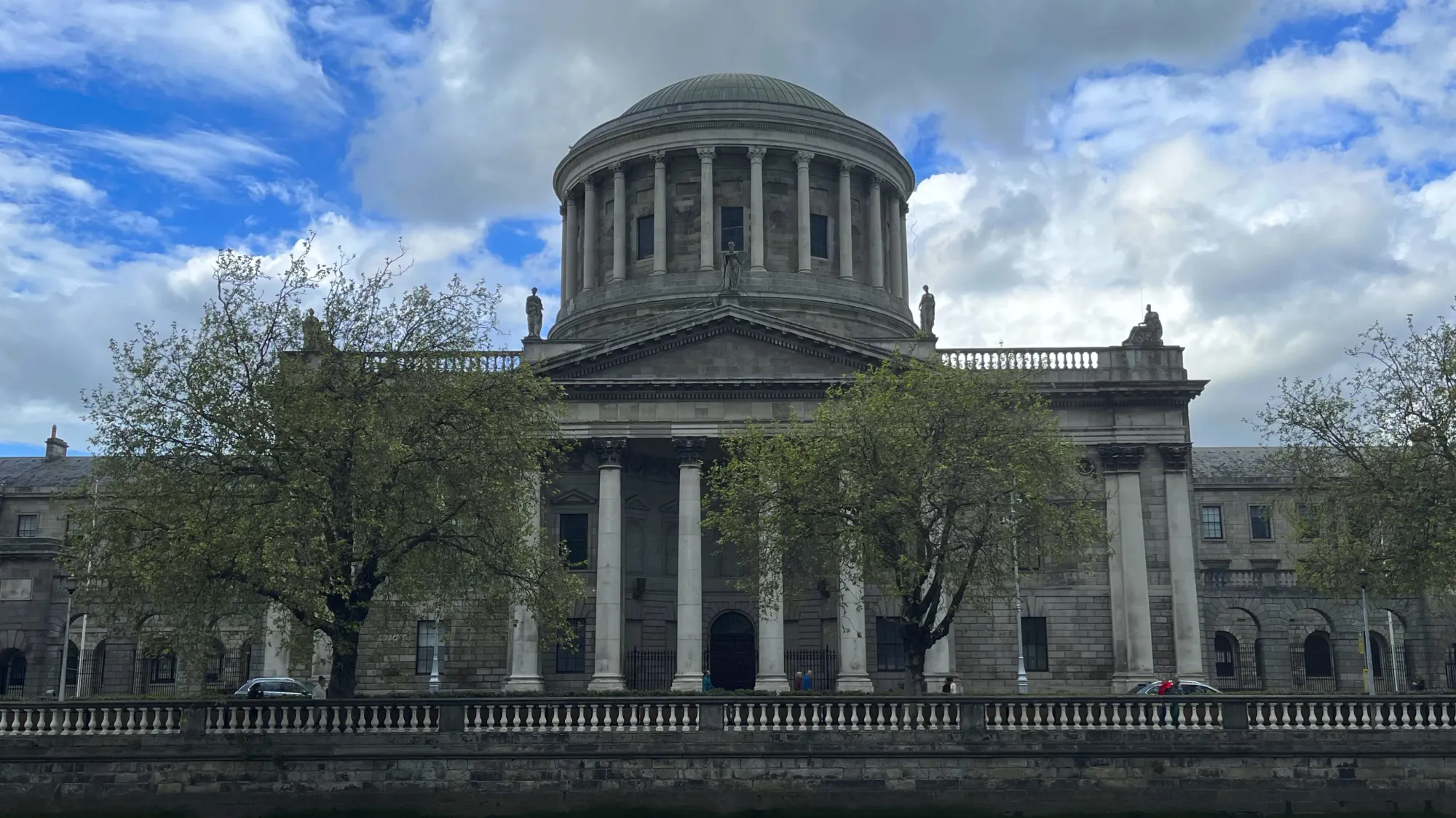 Columned building with trees in the foreground