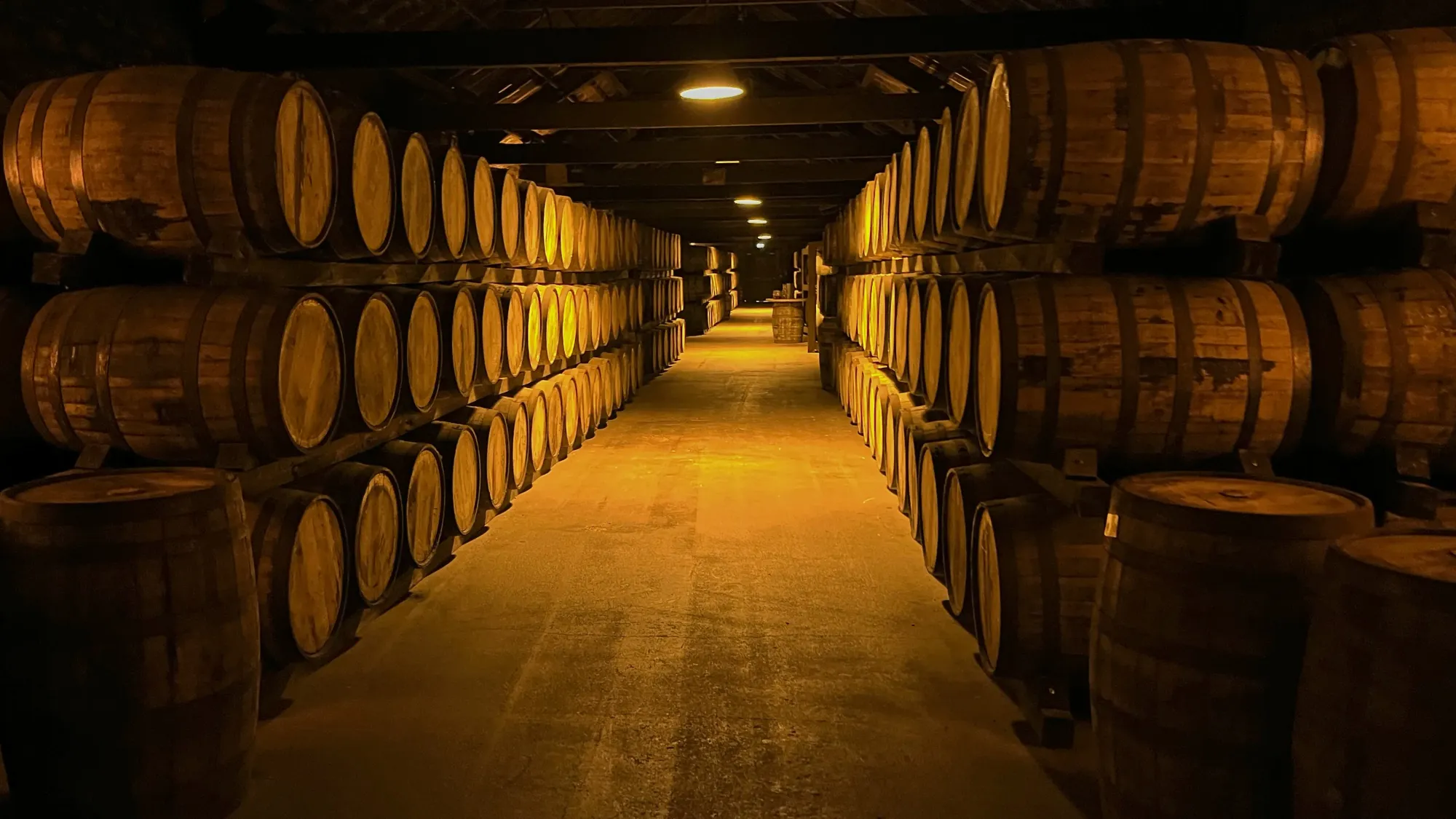 Rows stacked three high of barrels of whiskey