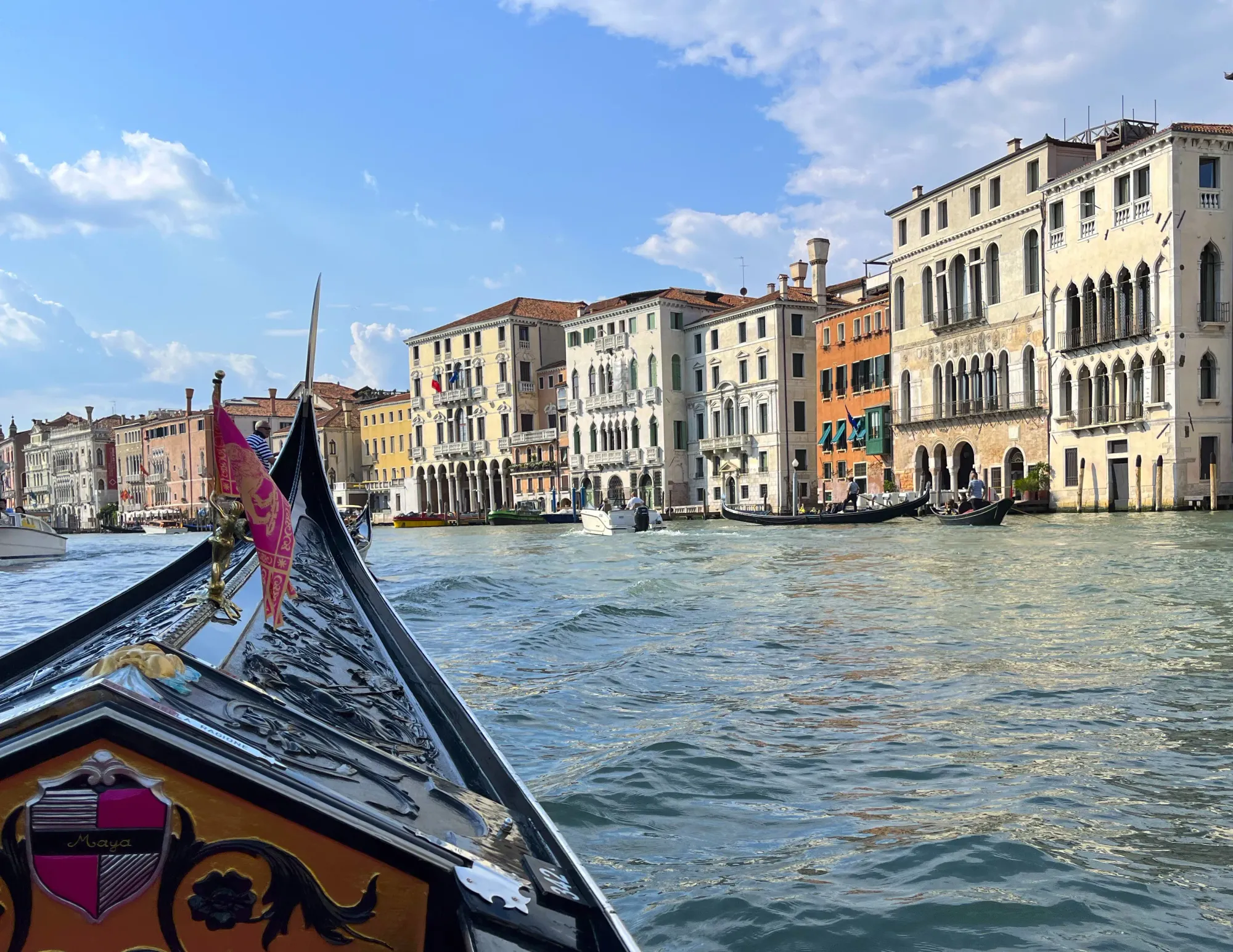 Tip of a gondola with a Venetian flag flying