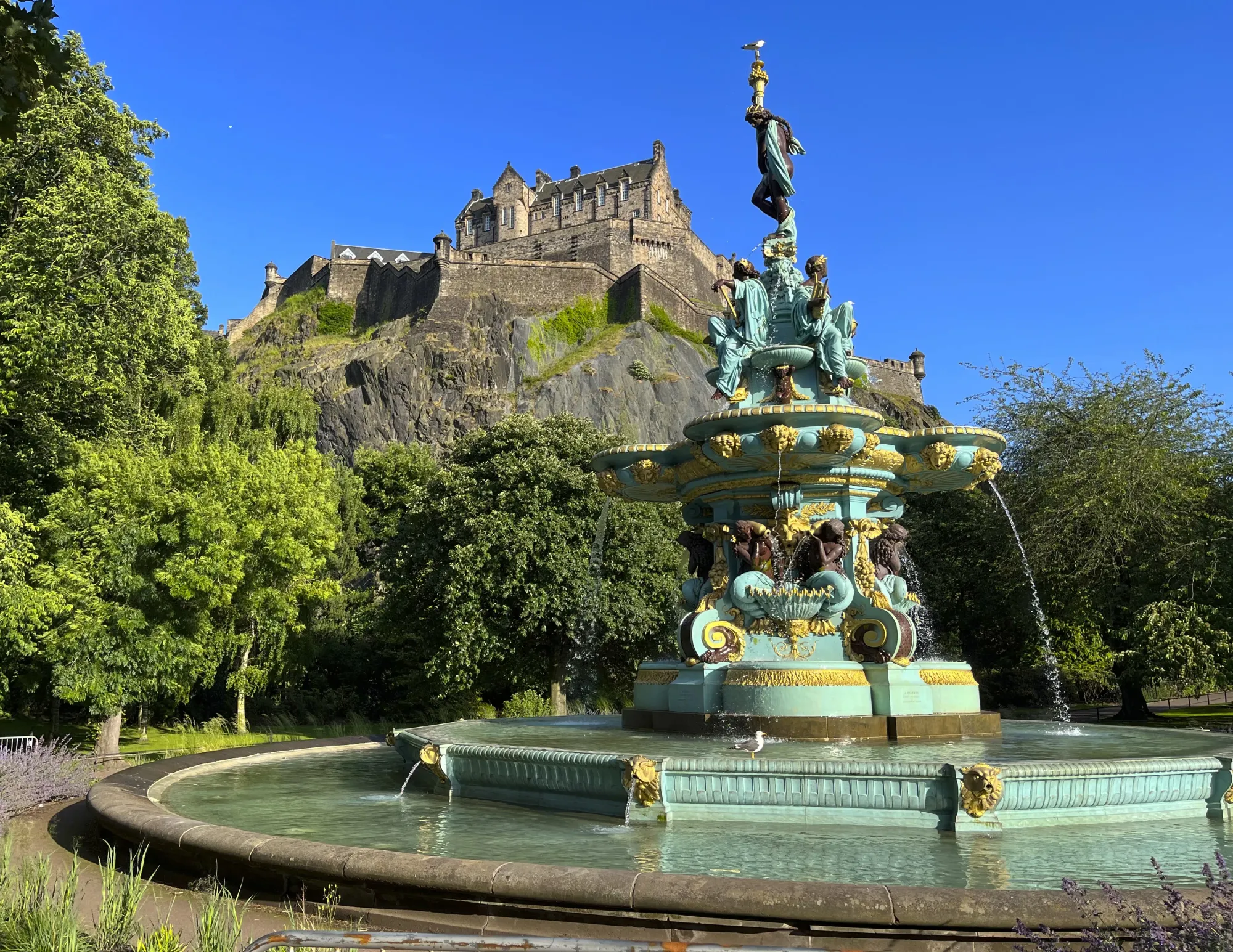 Green fountain with Edinburgh Castle set behind it