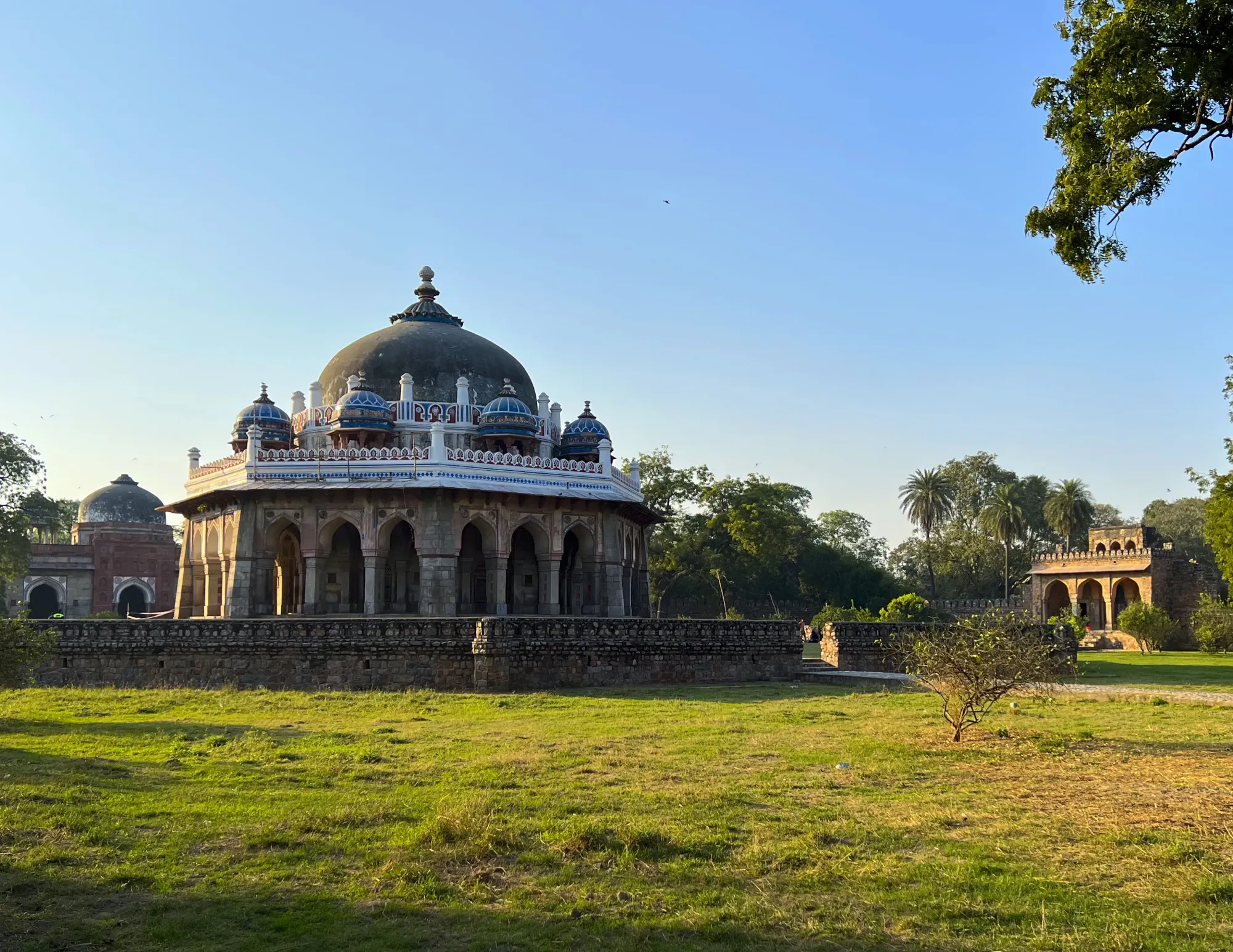 Dome adorned with white decorations on a green grassy lawn