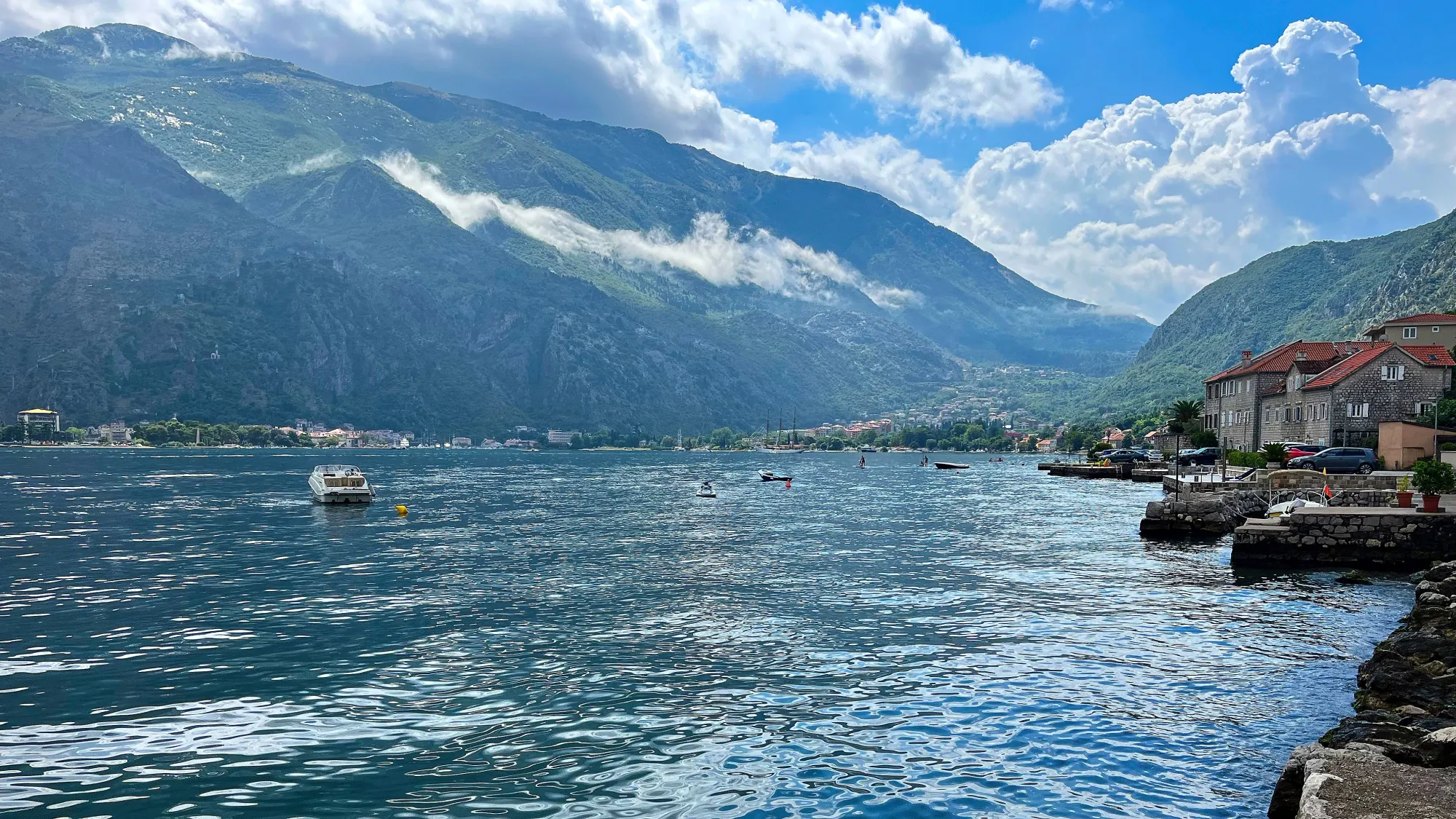 Stone houses lining the water of the bay