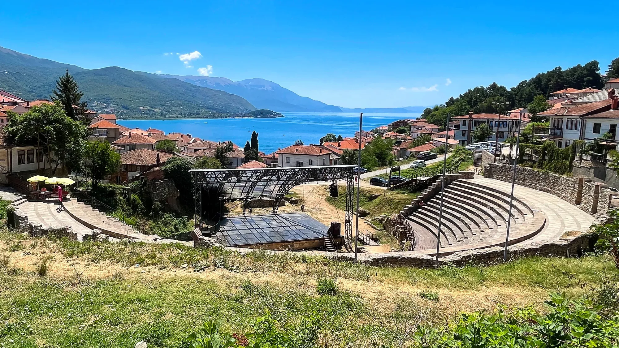 Stone amphitheater set into the mountain overlooking the lake