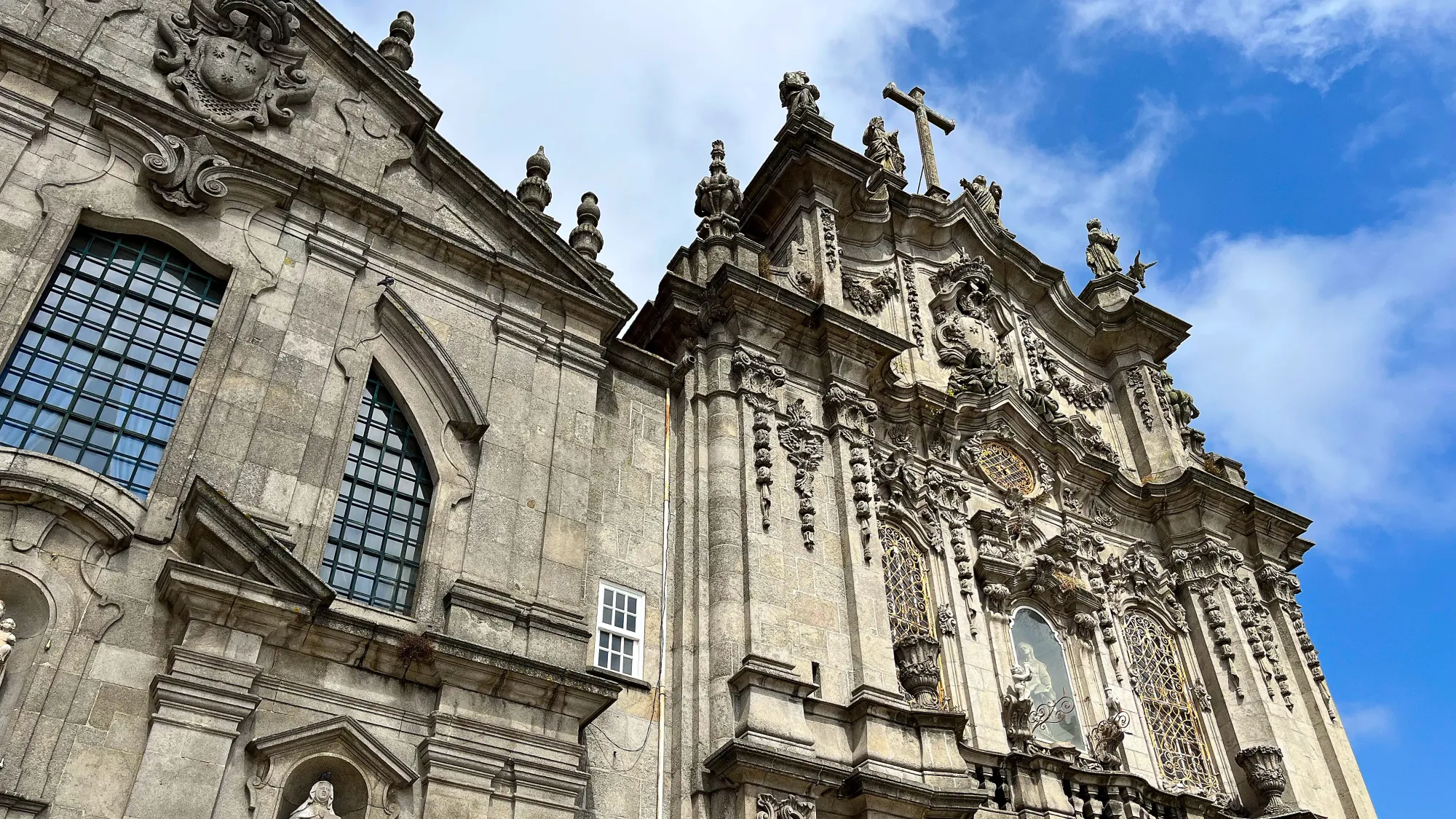 Grey stone church facade with detailed statues