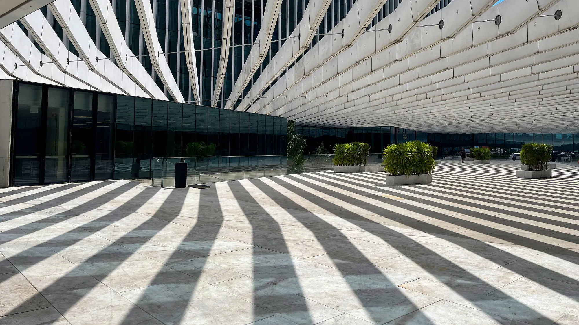 White striped ceiling casting a striped shadow over the courtyard