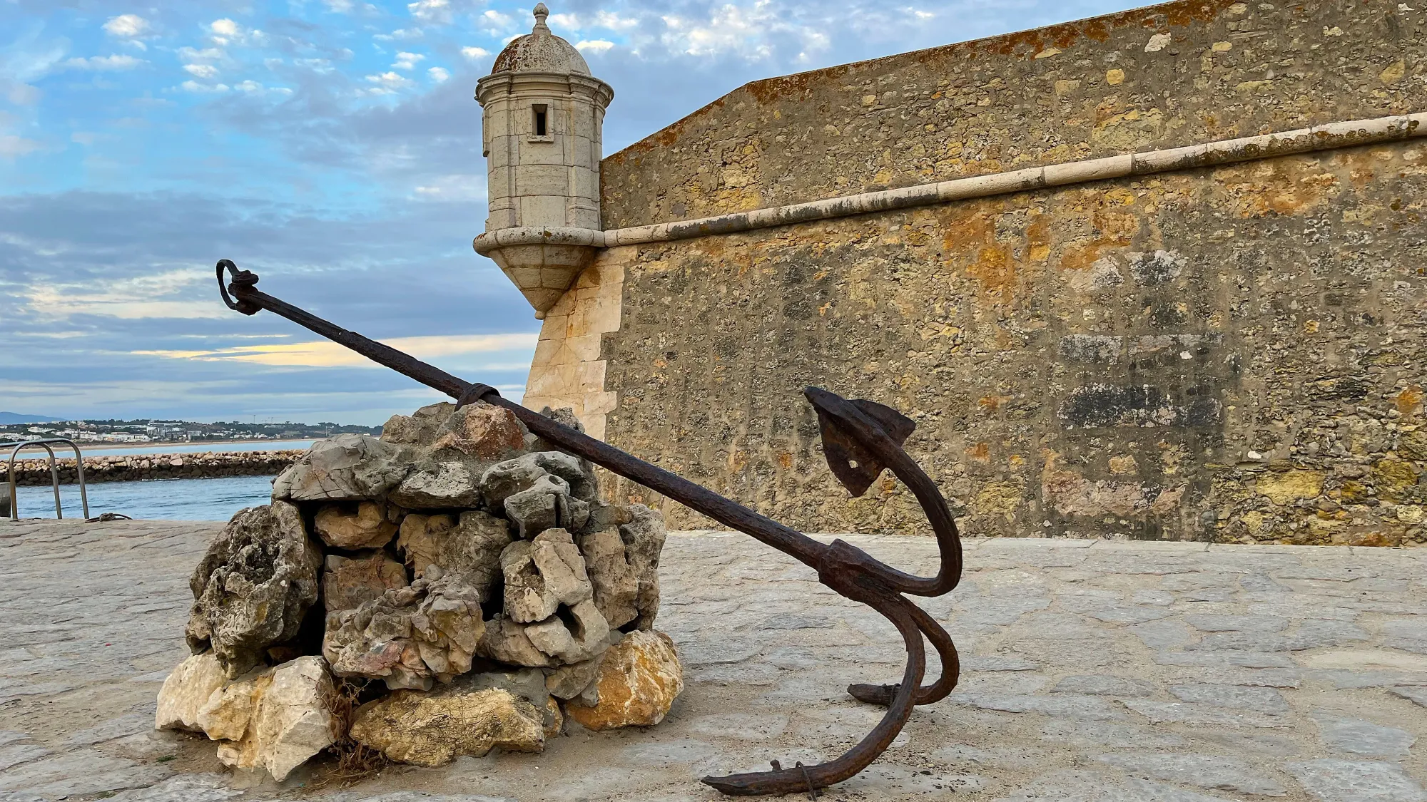 Anchor in front of a stone wall