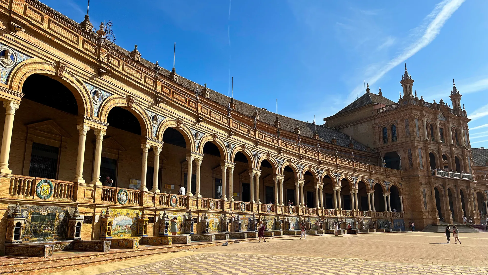 Series of arches with a central building covered in tiling