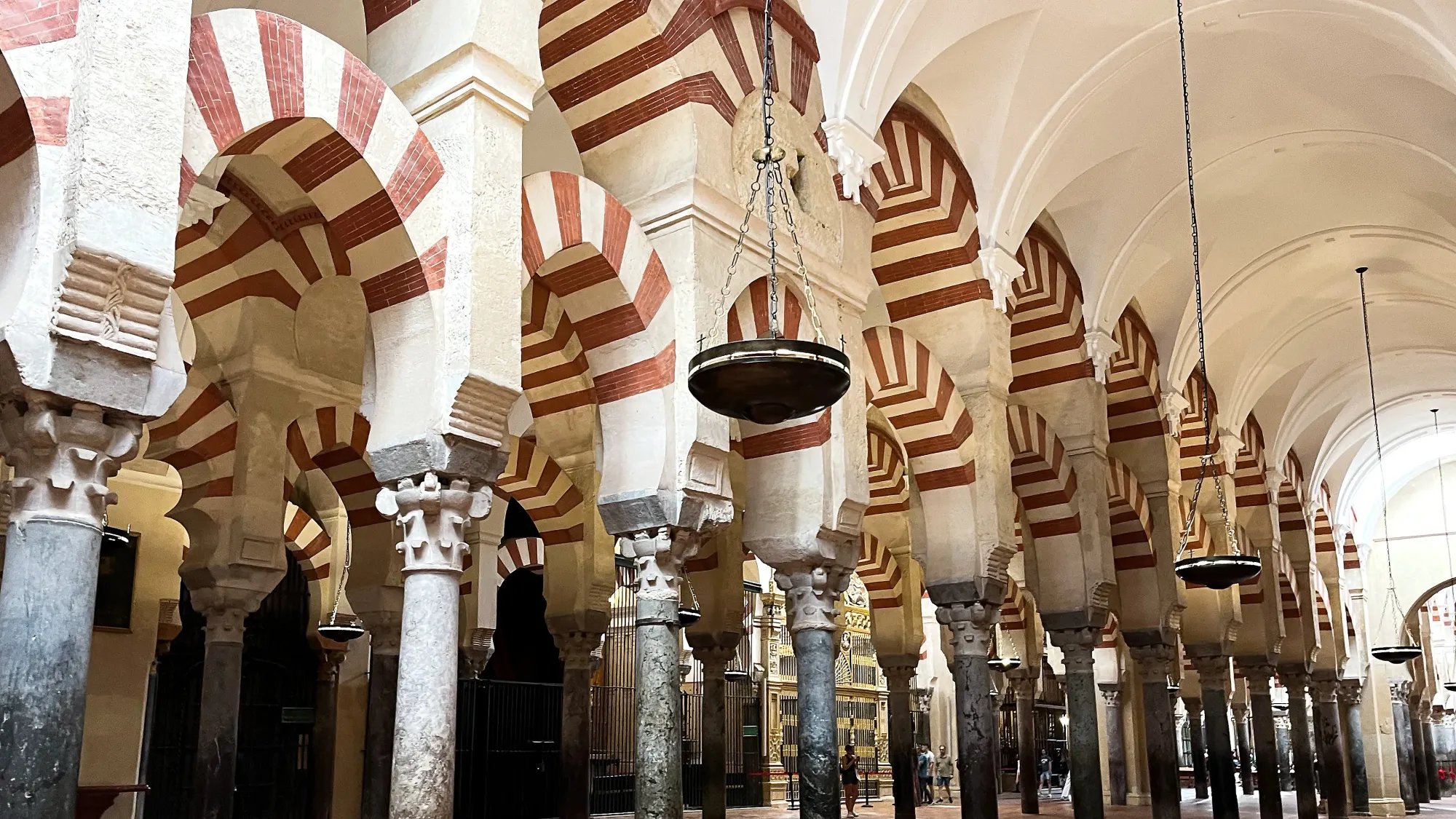 Red and white striped archways