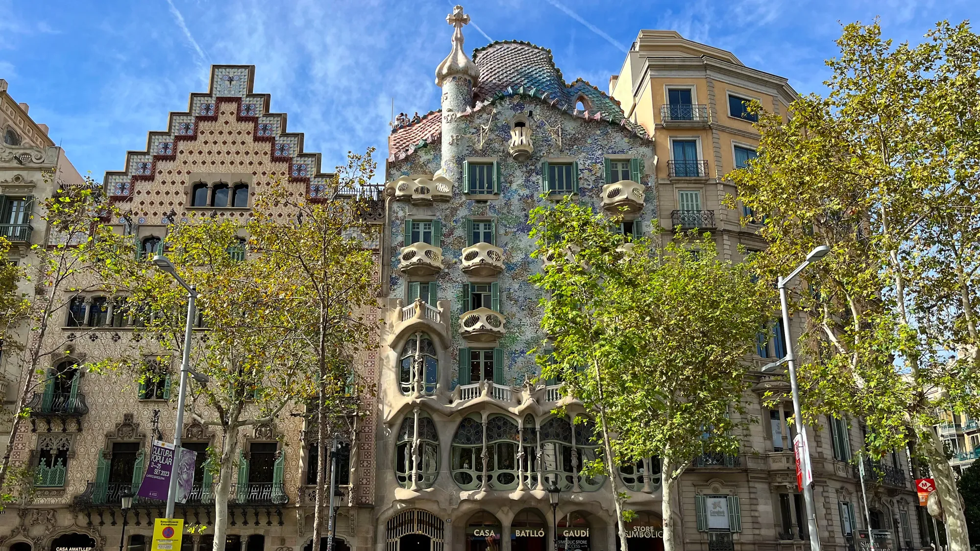 Ornate facade of a home with wonky balconies and lots of tiles