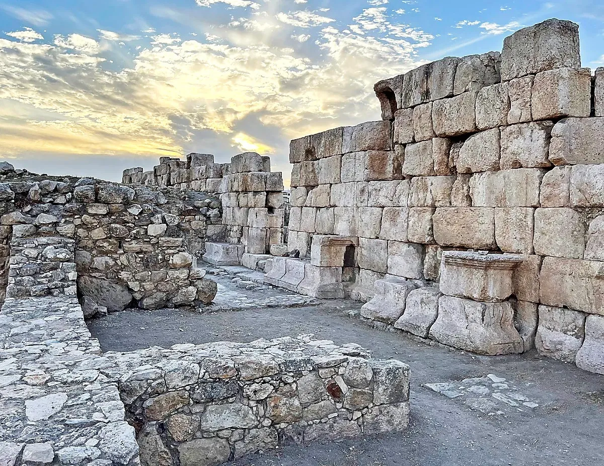 Dilapidated stones against a setting sun