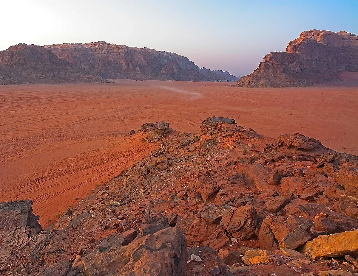 Red-orange sand from a rocky outcrop