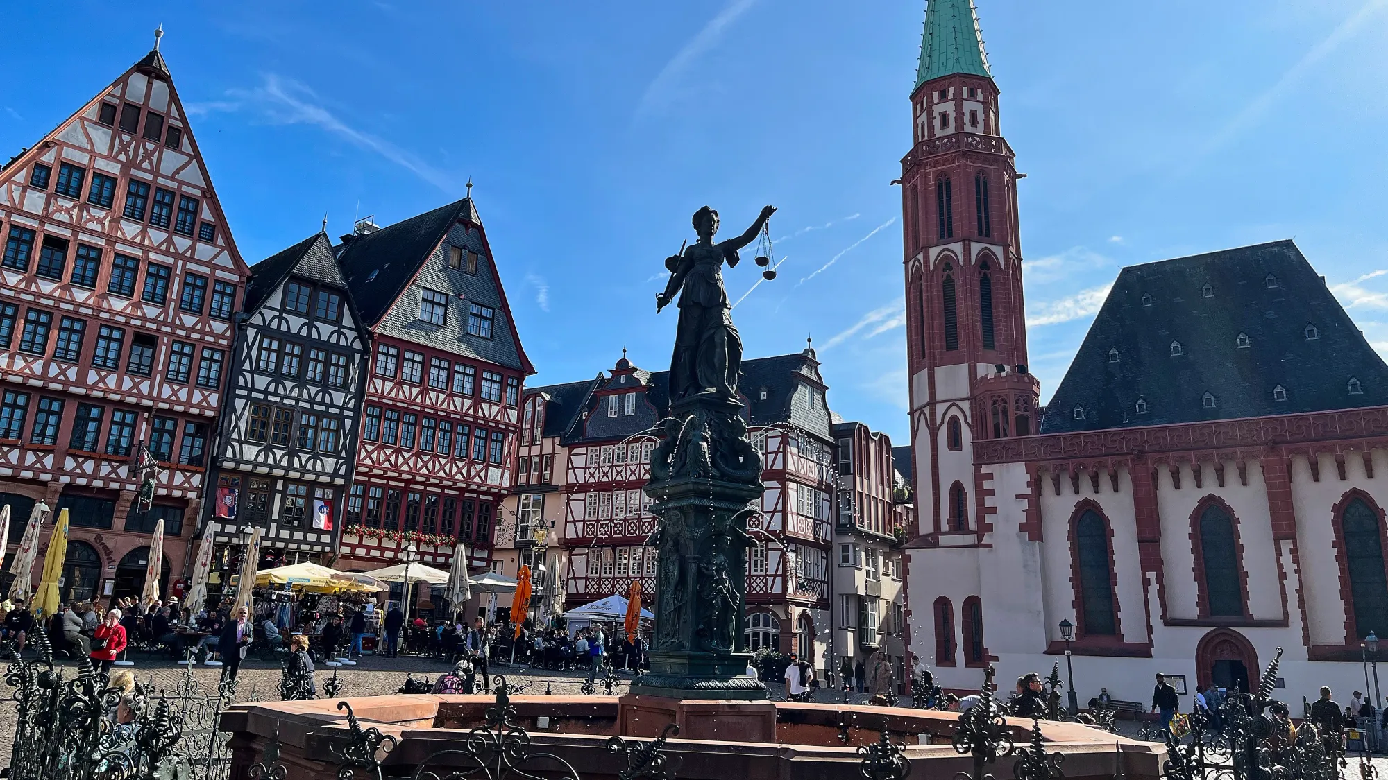 A Bavarian style plaza with a statue/fountain in the center