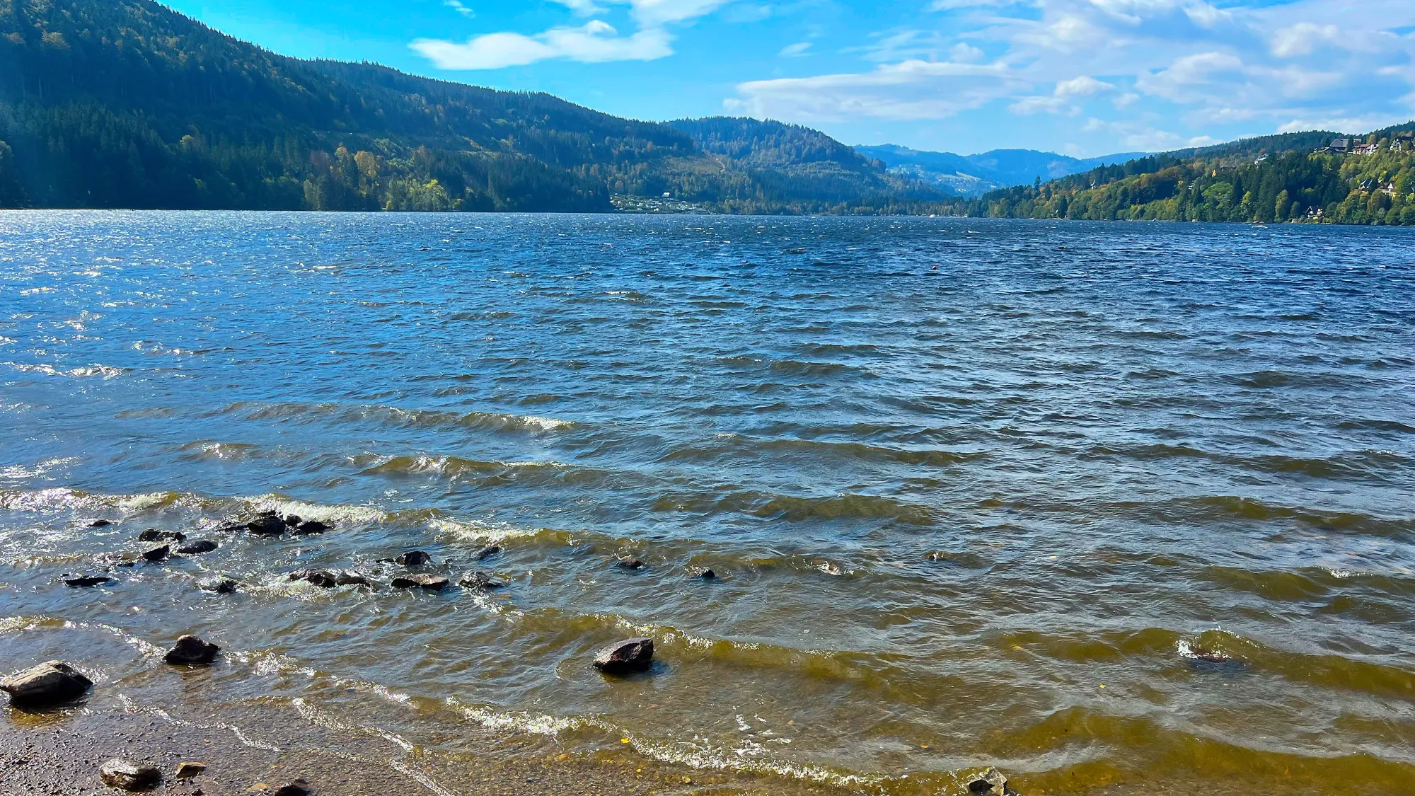 Closeup of the waves lapping the shore along the lakeside