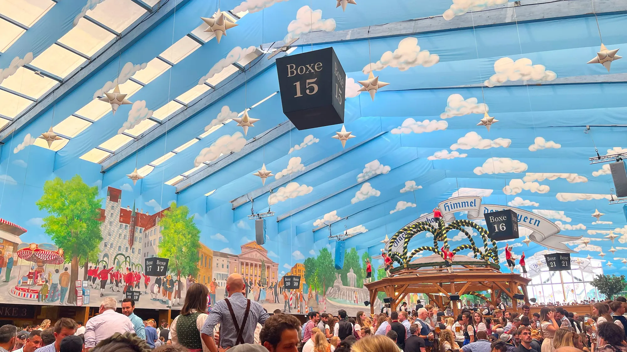 Tent with a blue ceiling and floating clouds