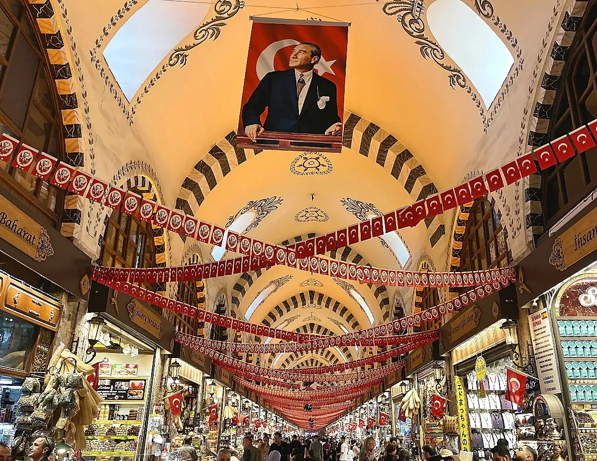 Covered Market with interweaving strings of Türkiye's flag and a large central flag of Türkiye's President