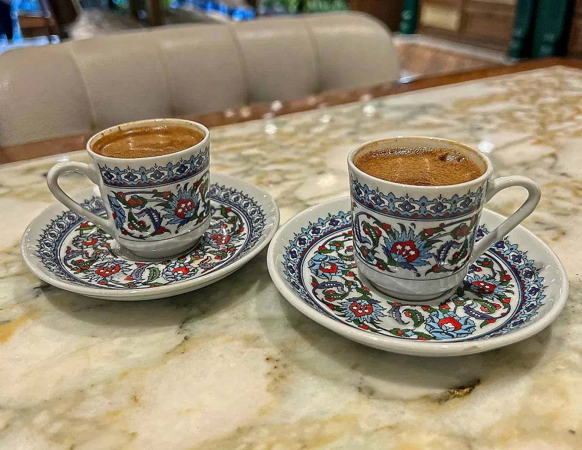 Small Turkish coffee cups with blue/red/green floral patterns