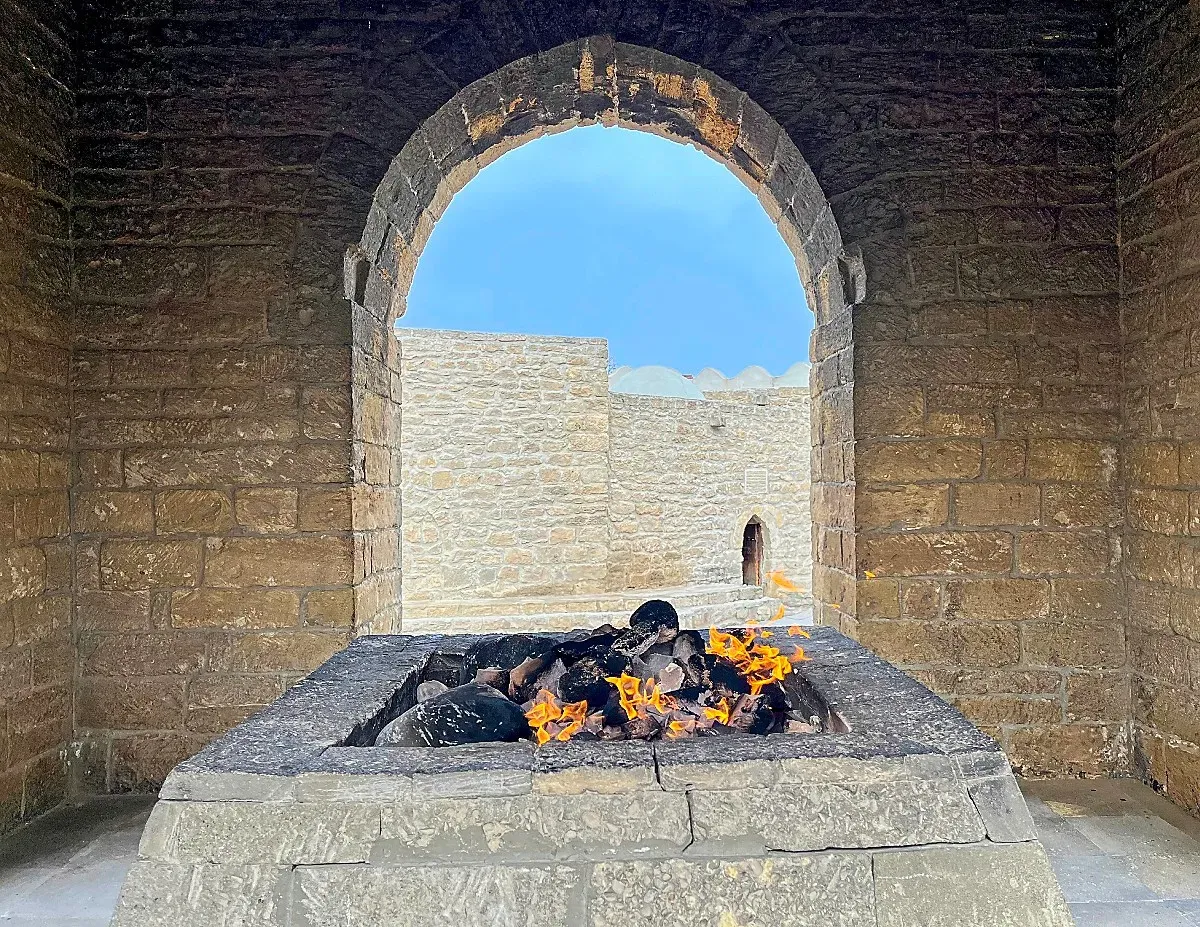 Stone temple with a fire burning in the center