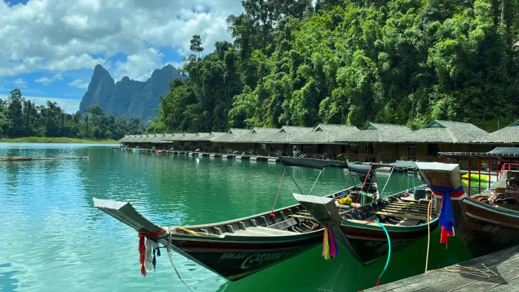 Boats floating in lake at Khao Sok National Park
