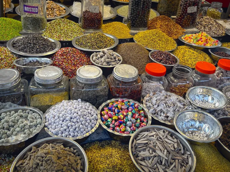 Indian spice shop with dozens of metal bowls of various Indian spices from the market.