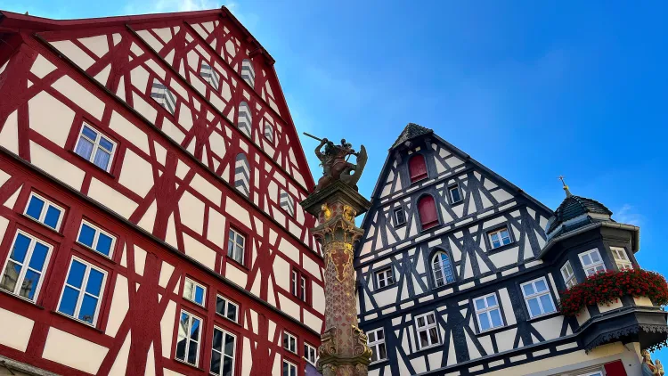Bavarian buildings with red and blue accents respectively