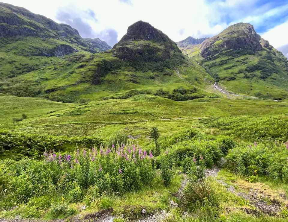 Three green mountains side-by-side in the Scottish Highlands