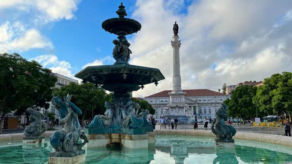 Fountain with a tall obelisk in the background